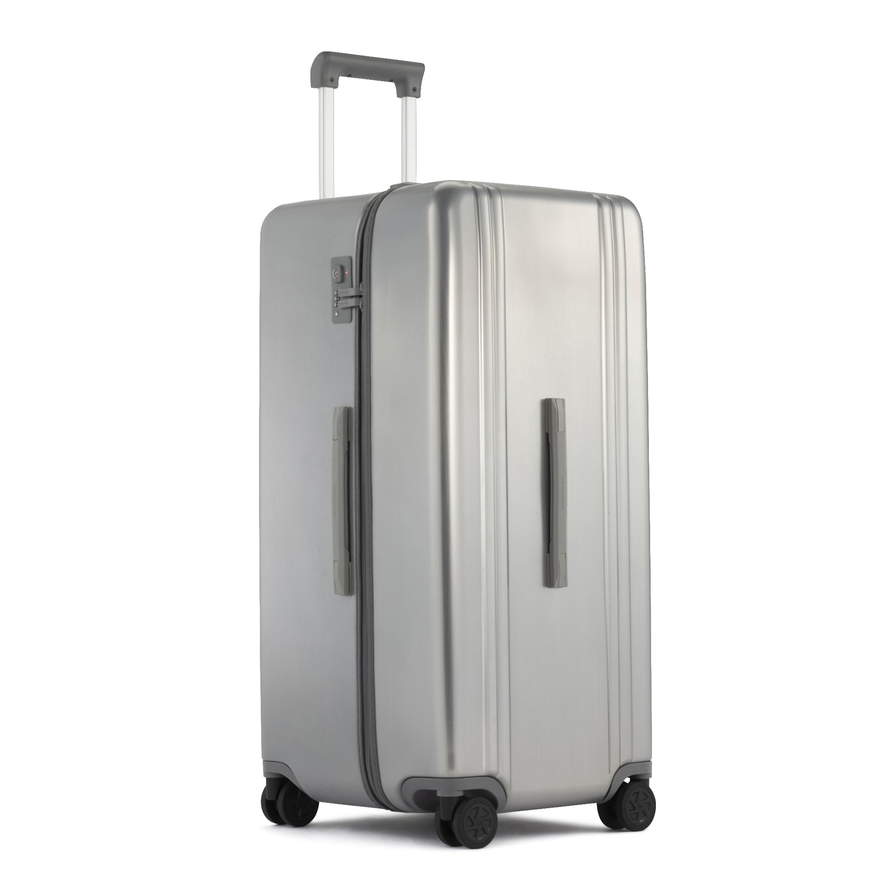 Silver suitcase with wheels and handle on a white background