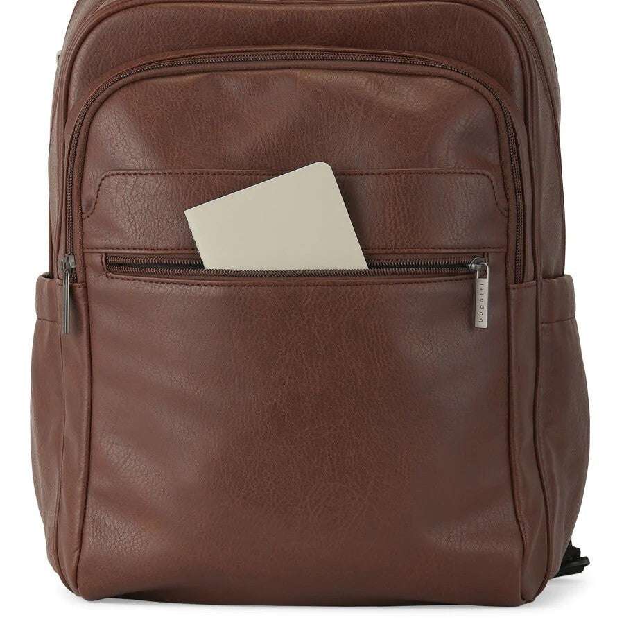 Brown leather backpack with a pocket containing a beige notebook on a white background