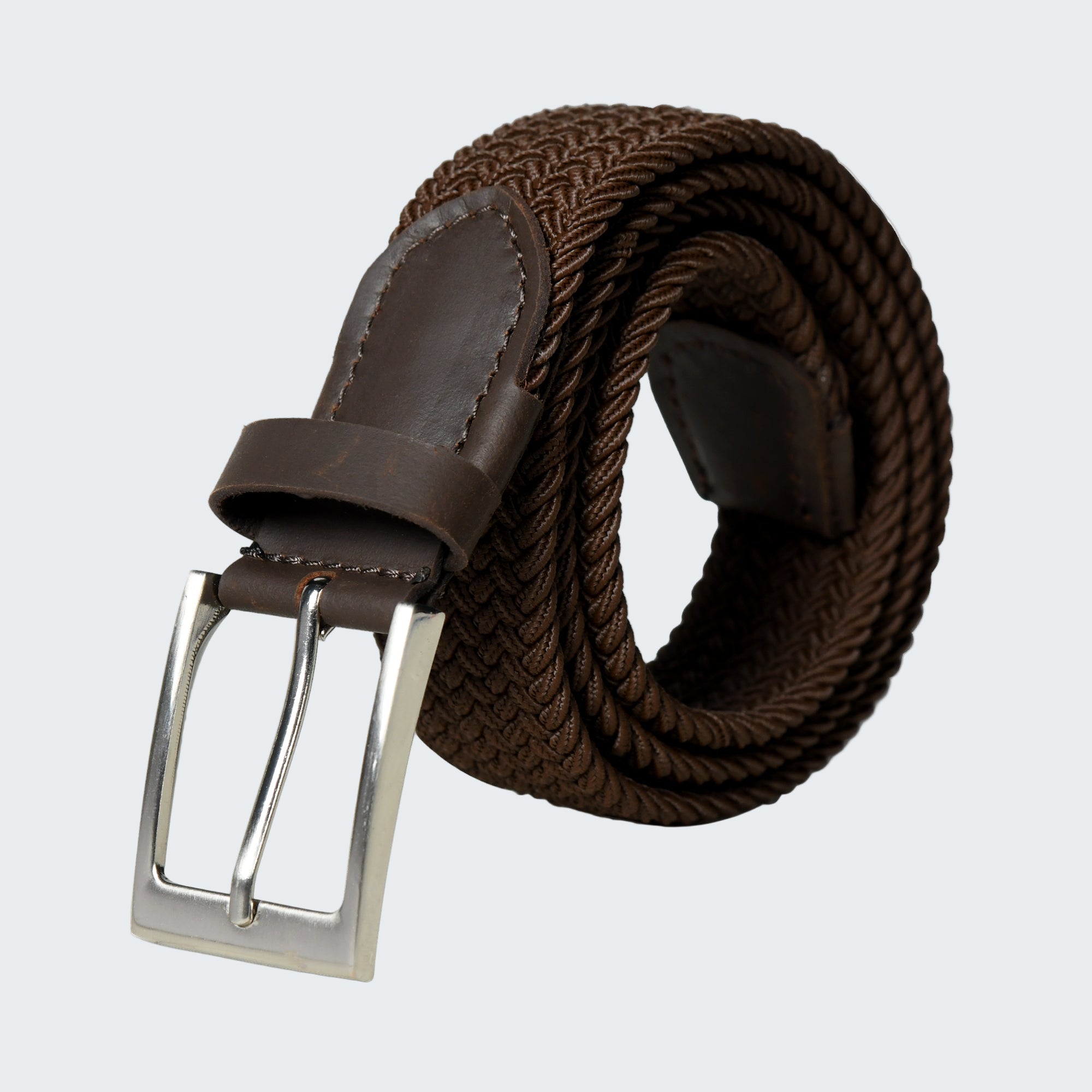 Brown woven belt with a silver buckle on a white background