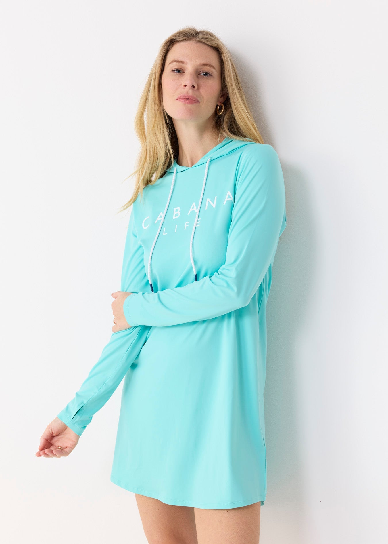 Woman wearing a light blue hoodie dress with 'Chase' branding on a white background