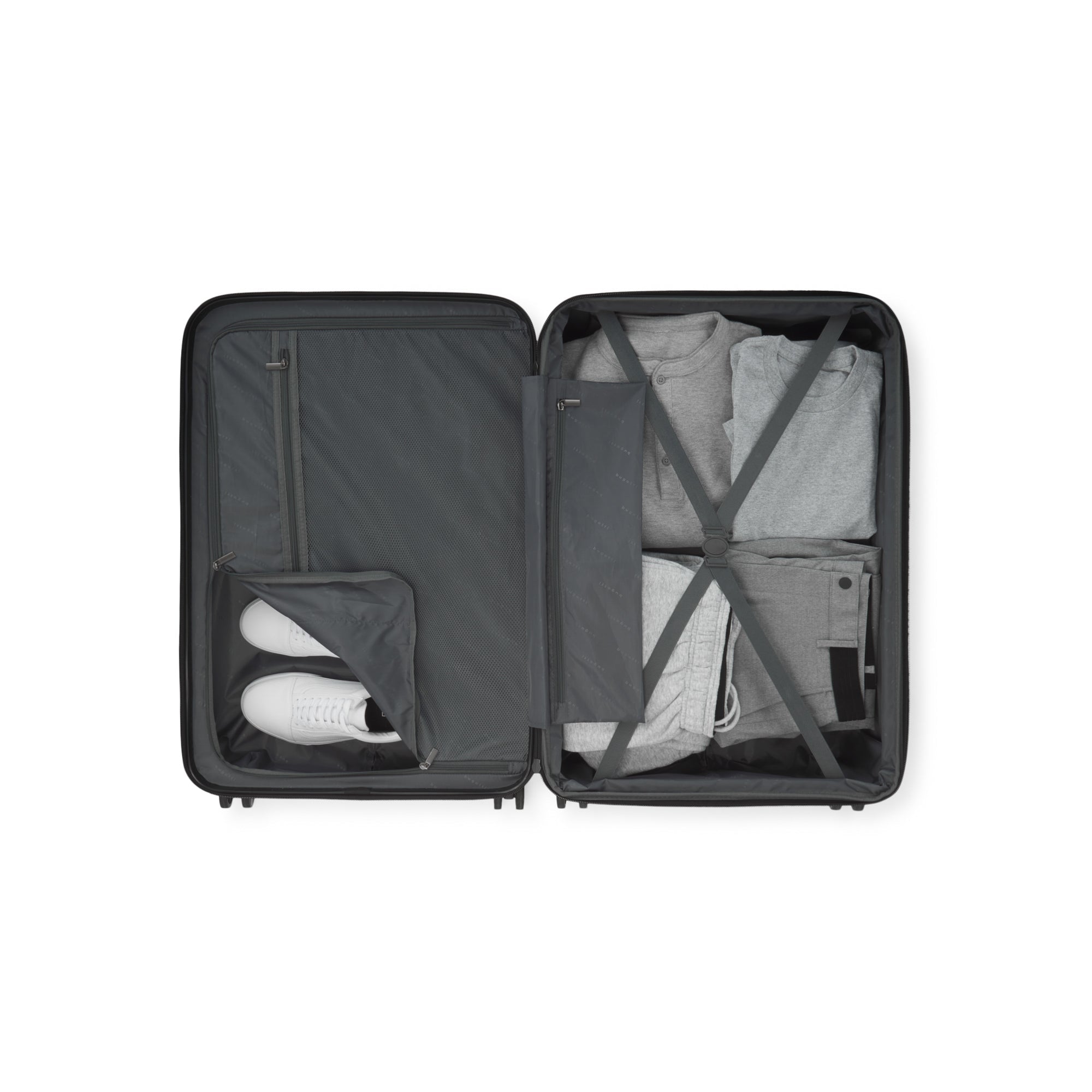 Open suitcase with clothes and shoes on a white background