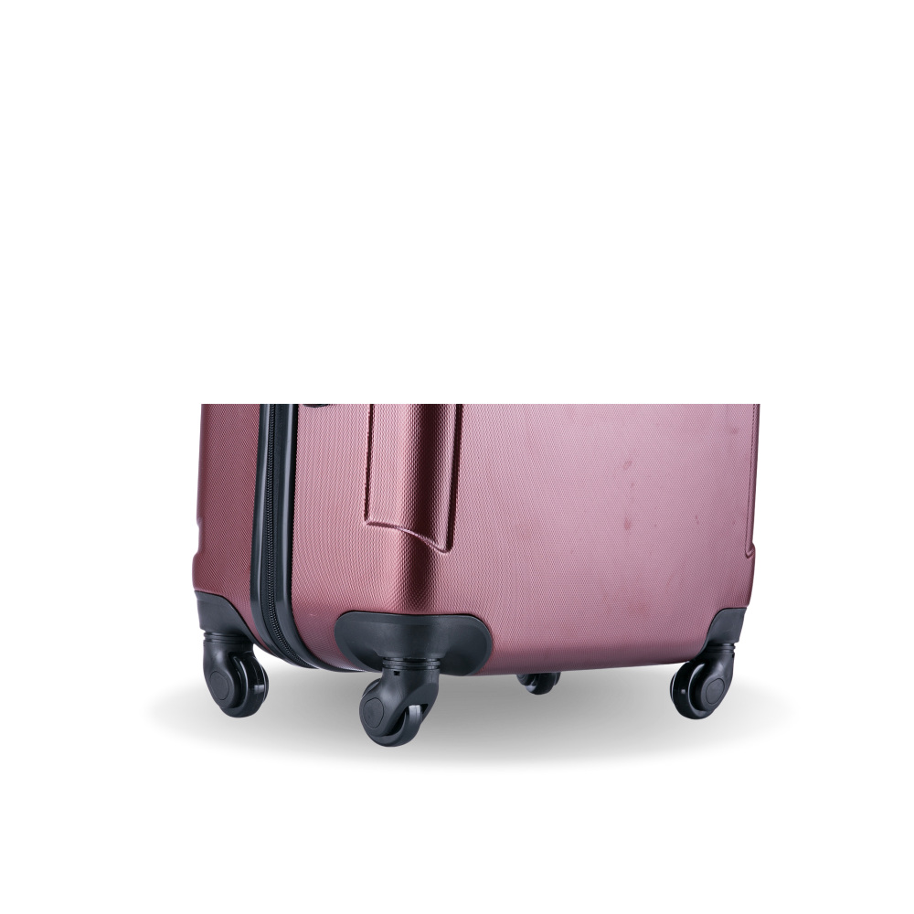 Pink suitcase with wheels on a white background