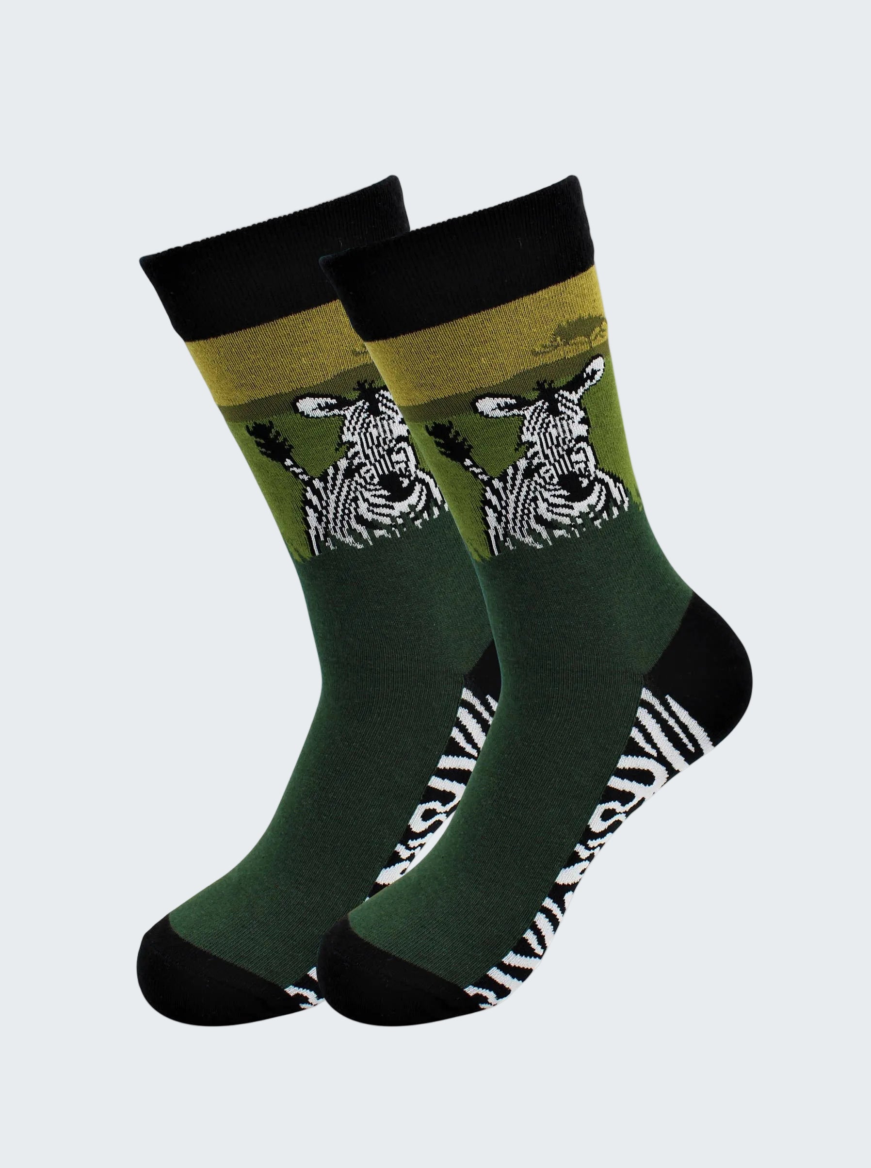 Two green socks with zebra design on a white background