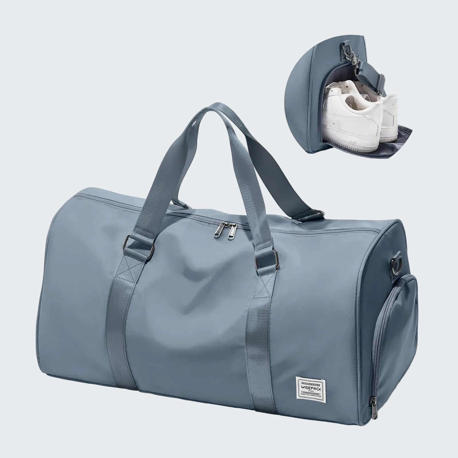 Blue duffel bag with a shoe compartment on a white background