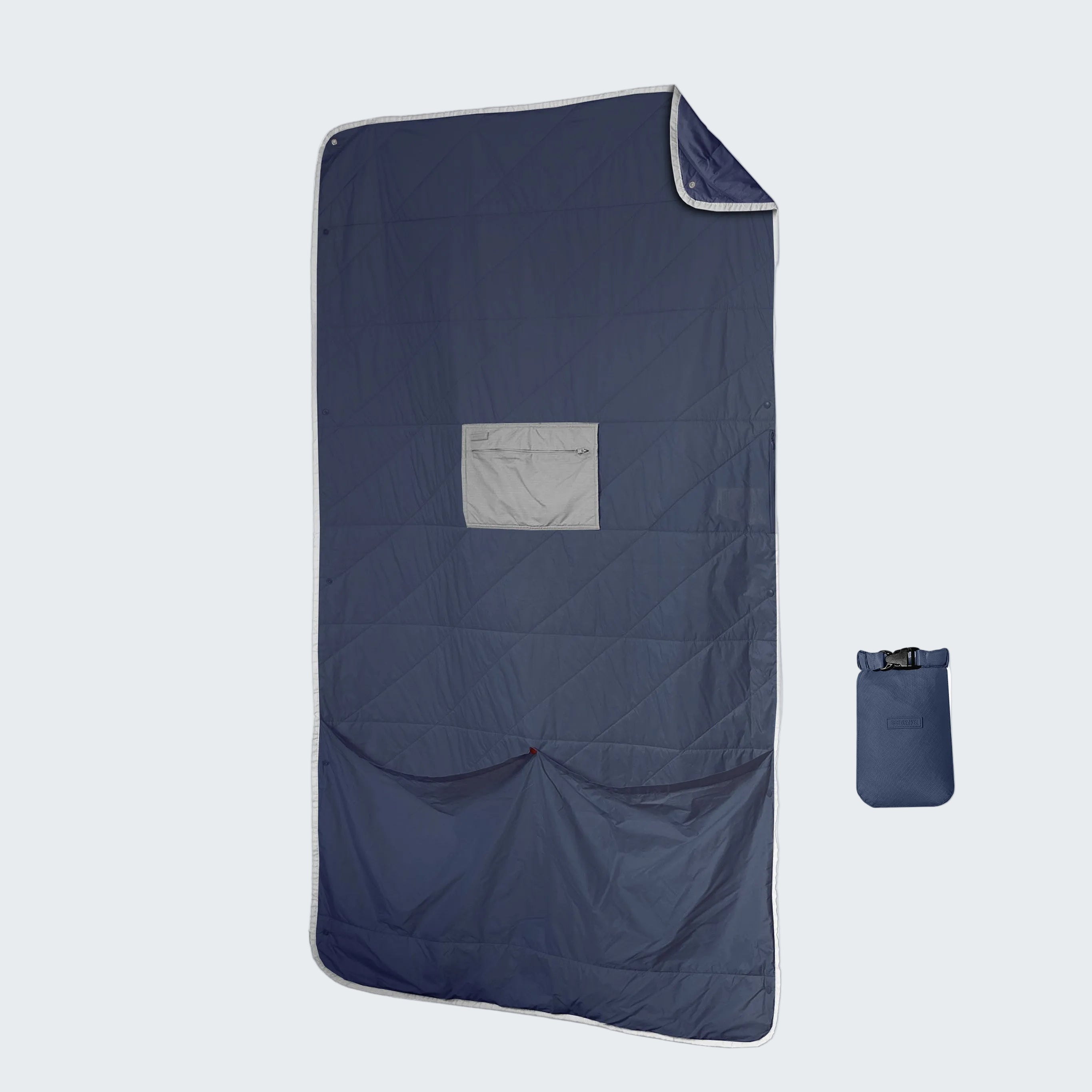 Navy blue quilt with a small pouch on a white background