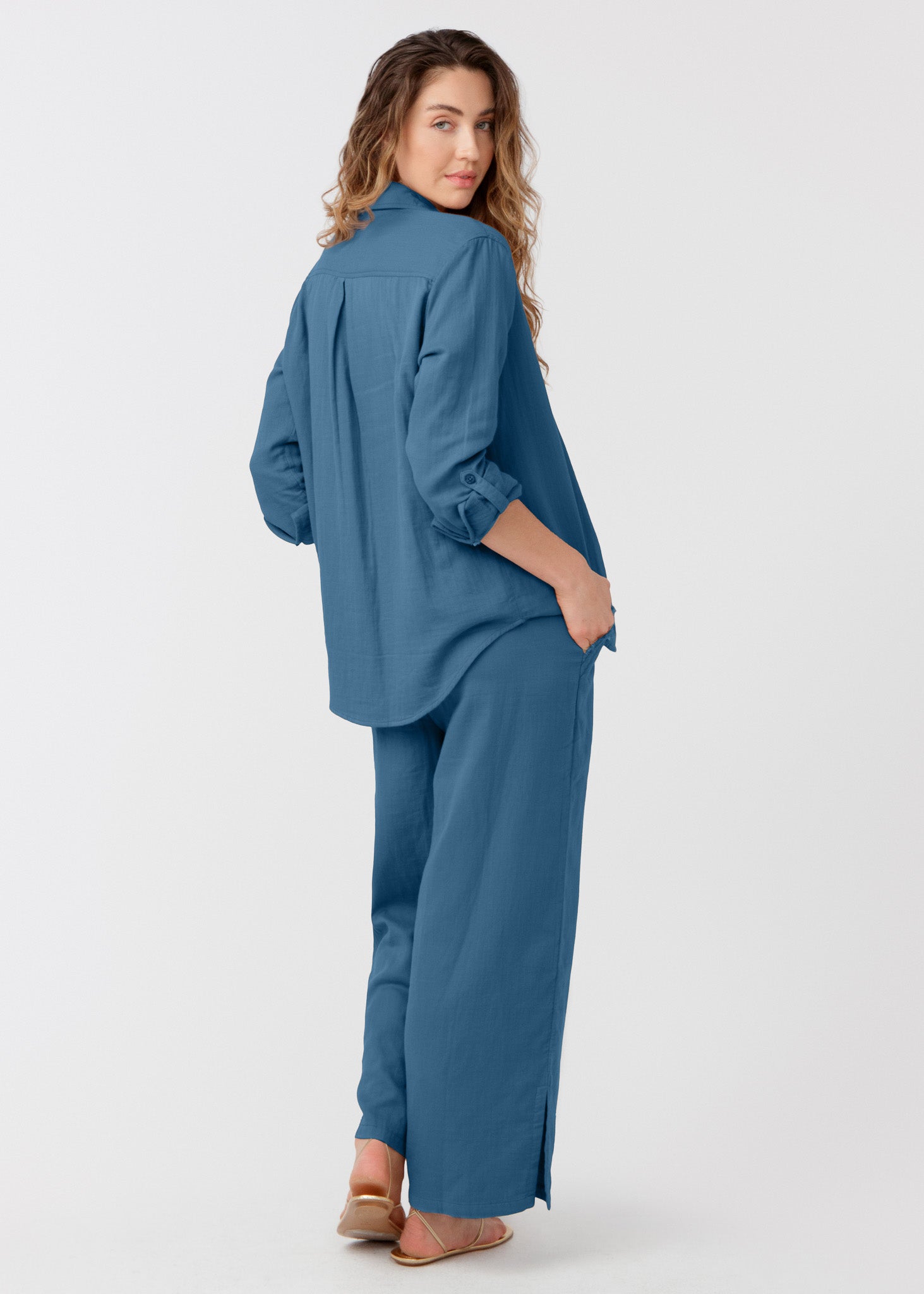 Woman wearing a blue outfit on a white background