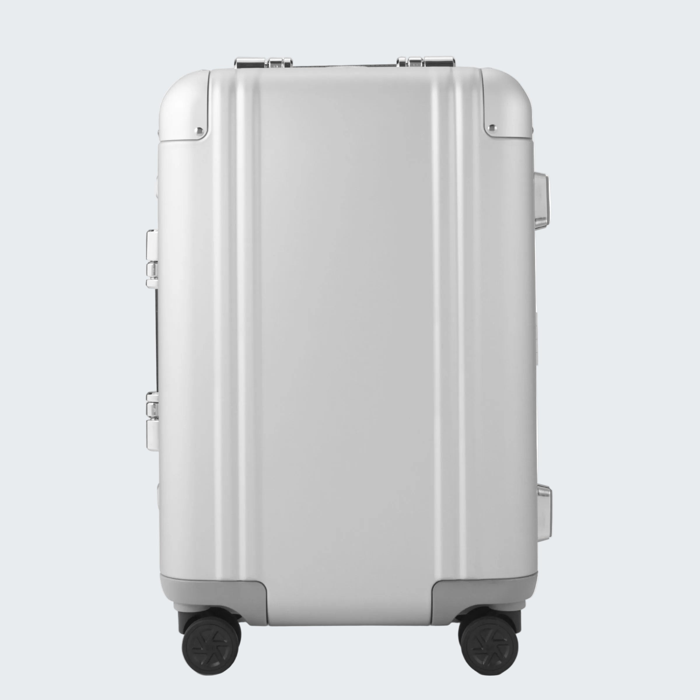 Silver suitcase with wheels on a white background