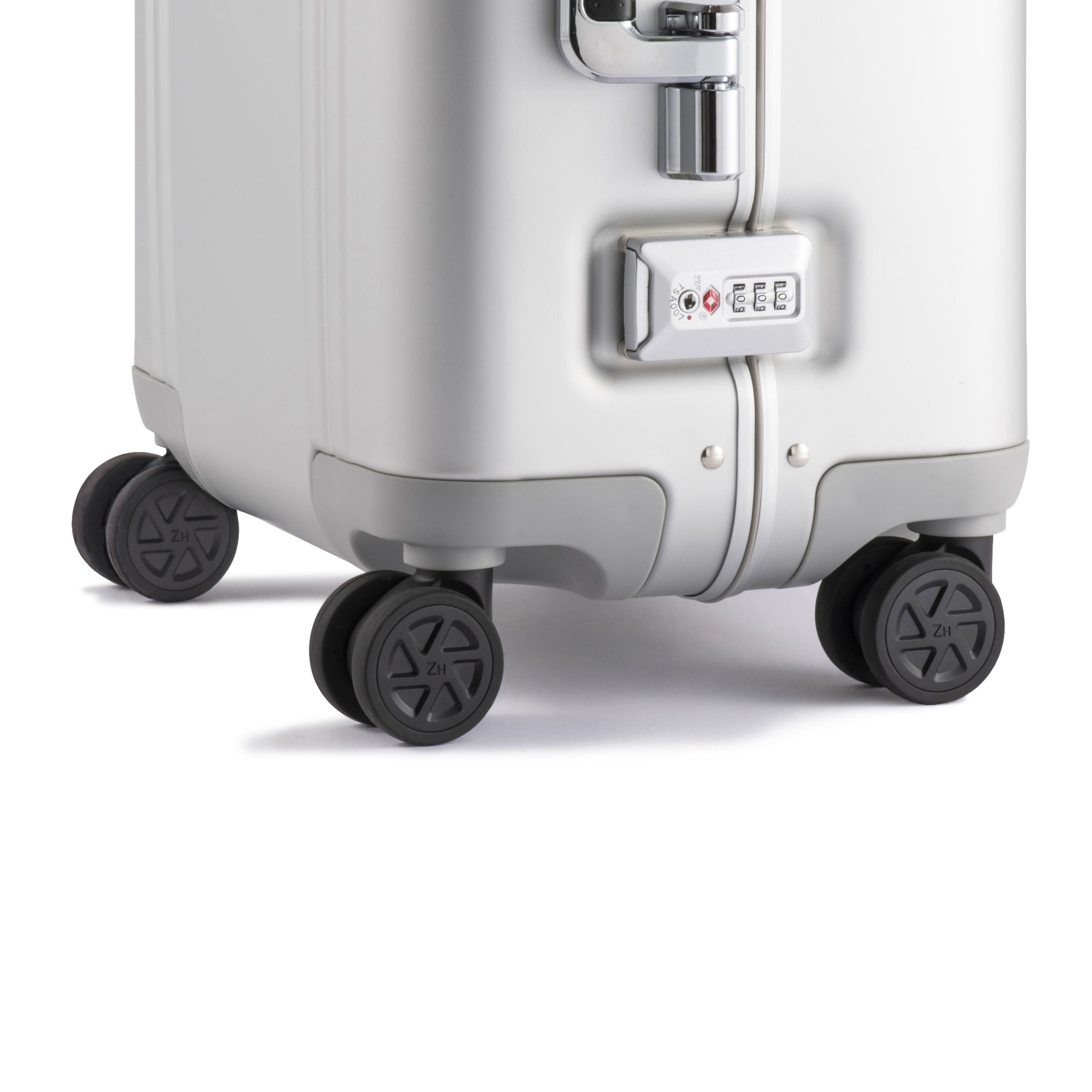 Silver suitcase with wheels on a white background