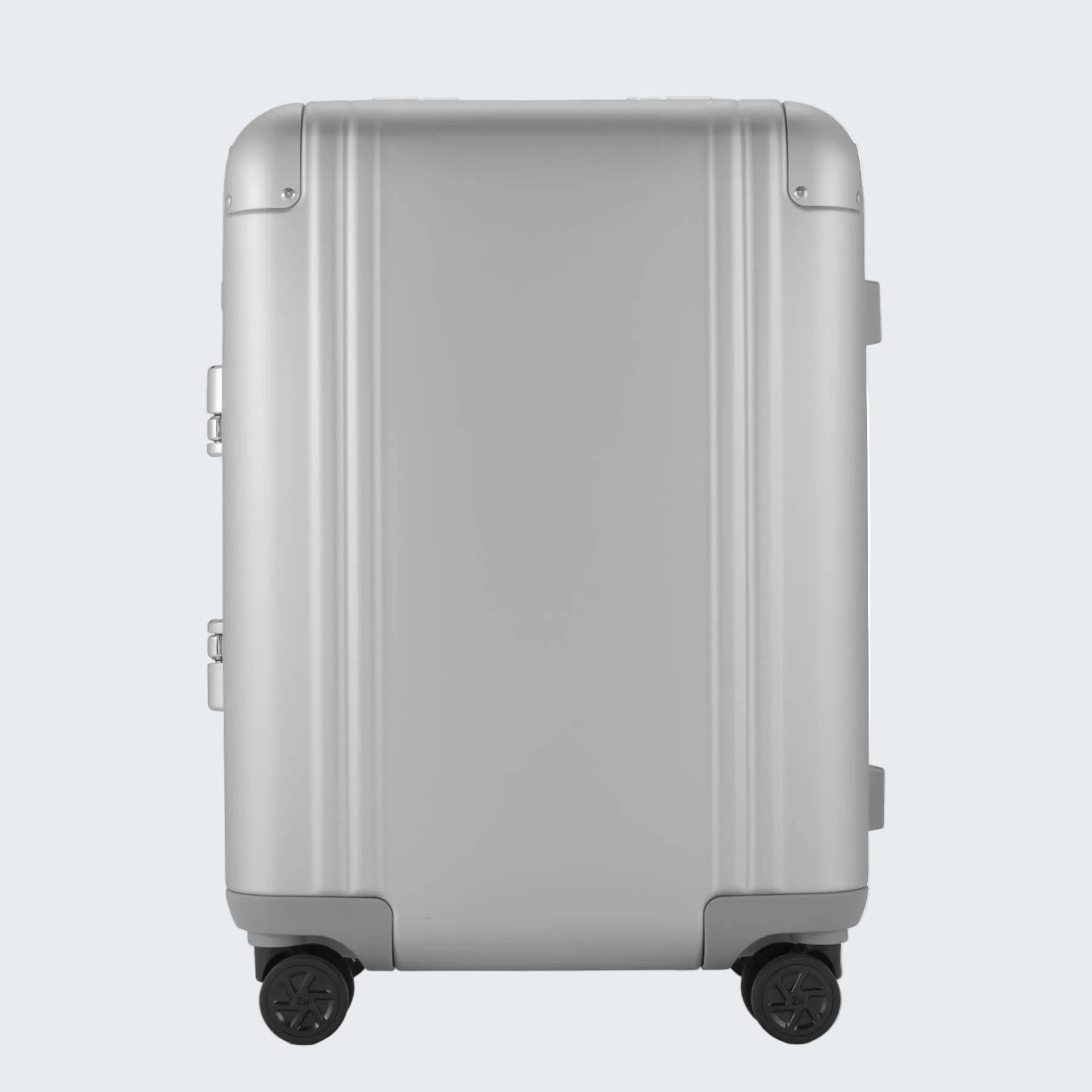 Silver suitcase with wheels on a white background