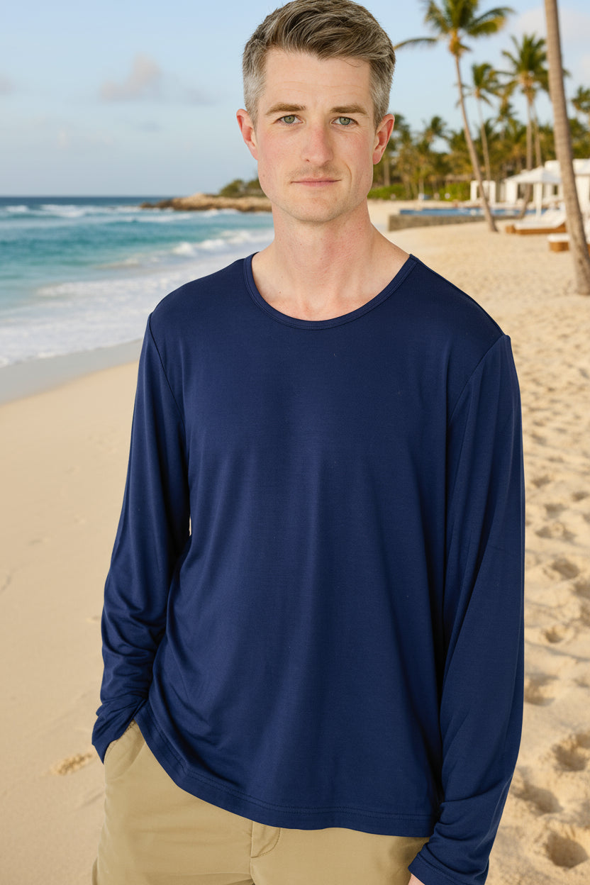 Man wearing a blue long-sleeve shirt against a white background