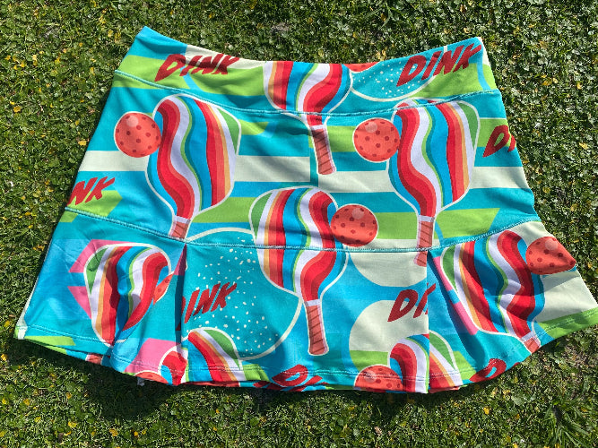 Colorful skirt with candy and watermelon design on grass