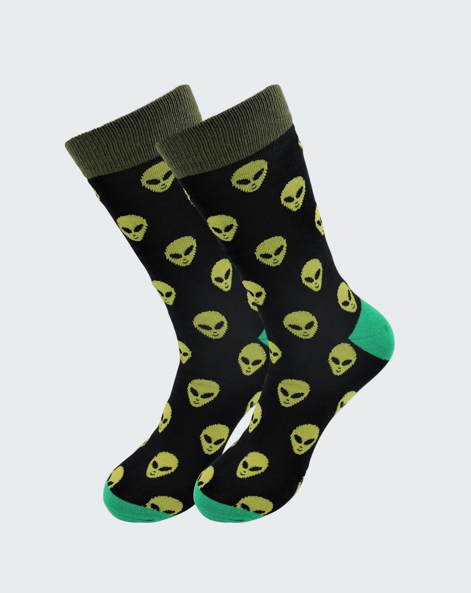 Black socks with yellow alien pattern and green accents on a white background