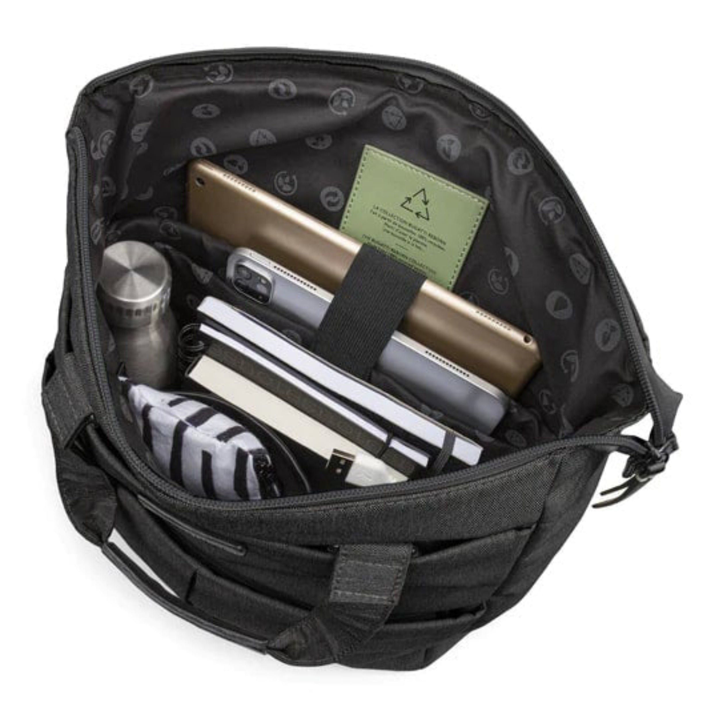 Black backpack with compartments containing a phone, tablet, and other items on a white background