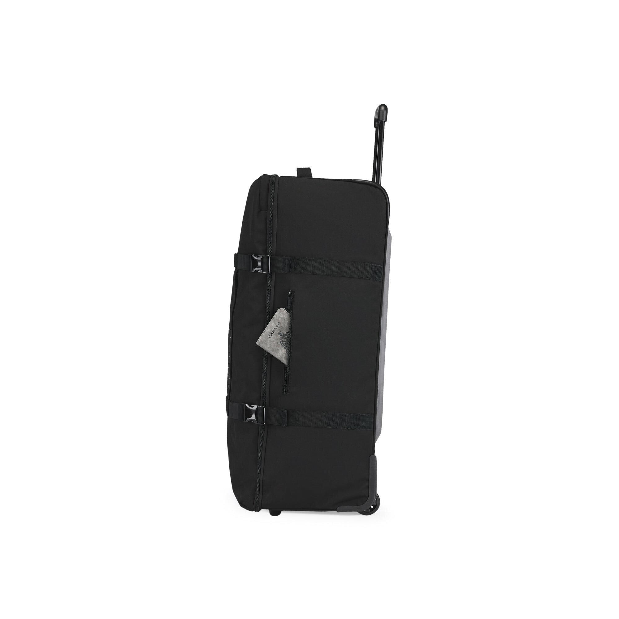 Black suitcase with wheels on a white background