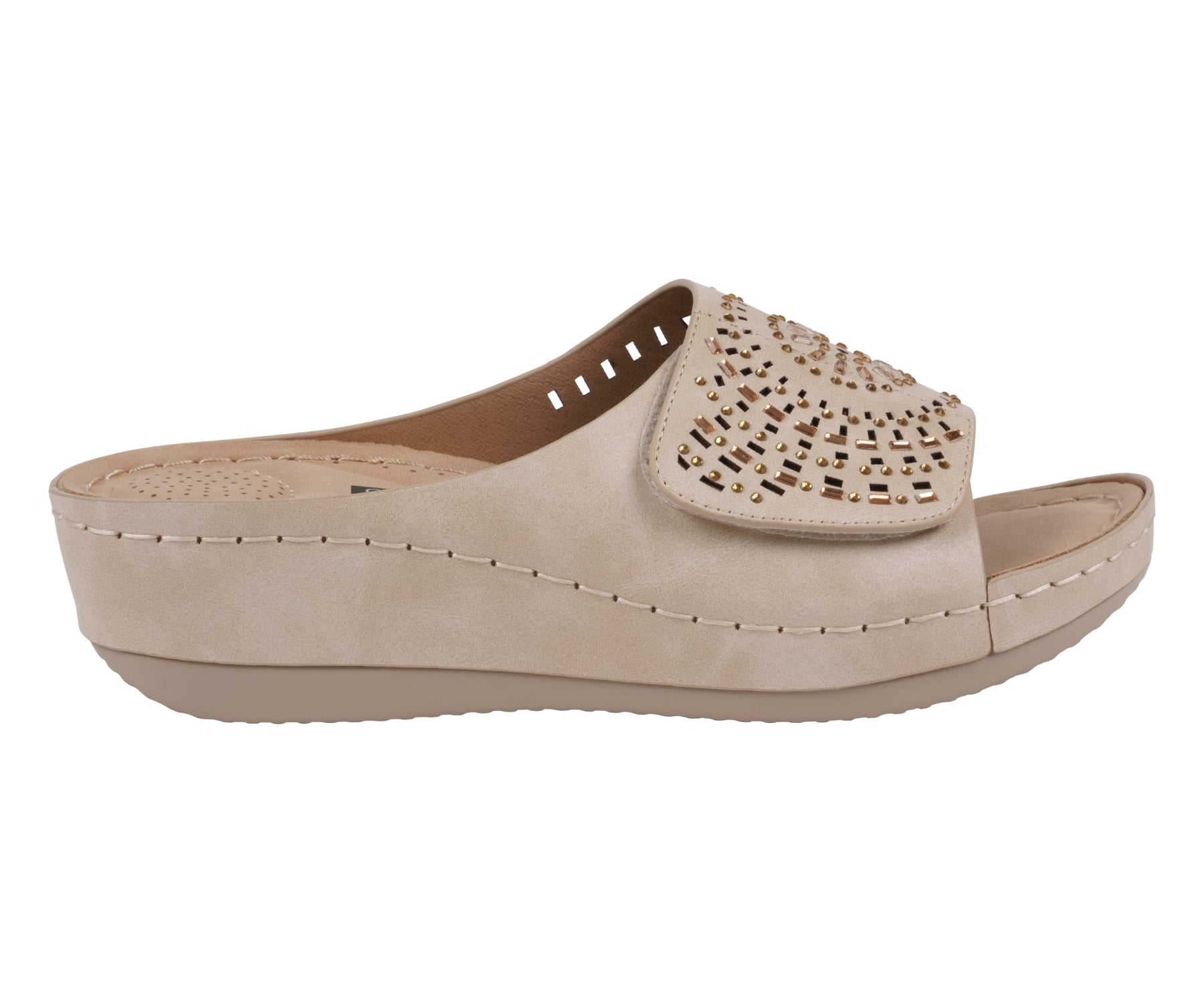 Beige sandal with a decorative buckle on a white background