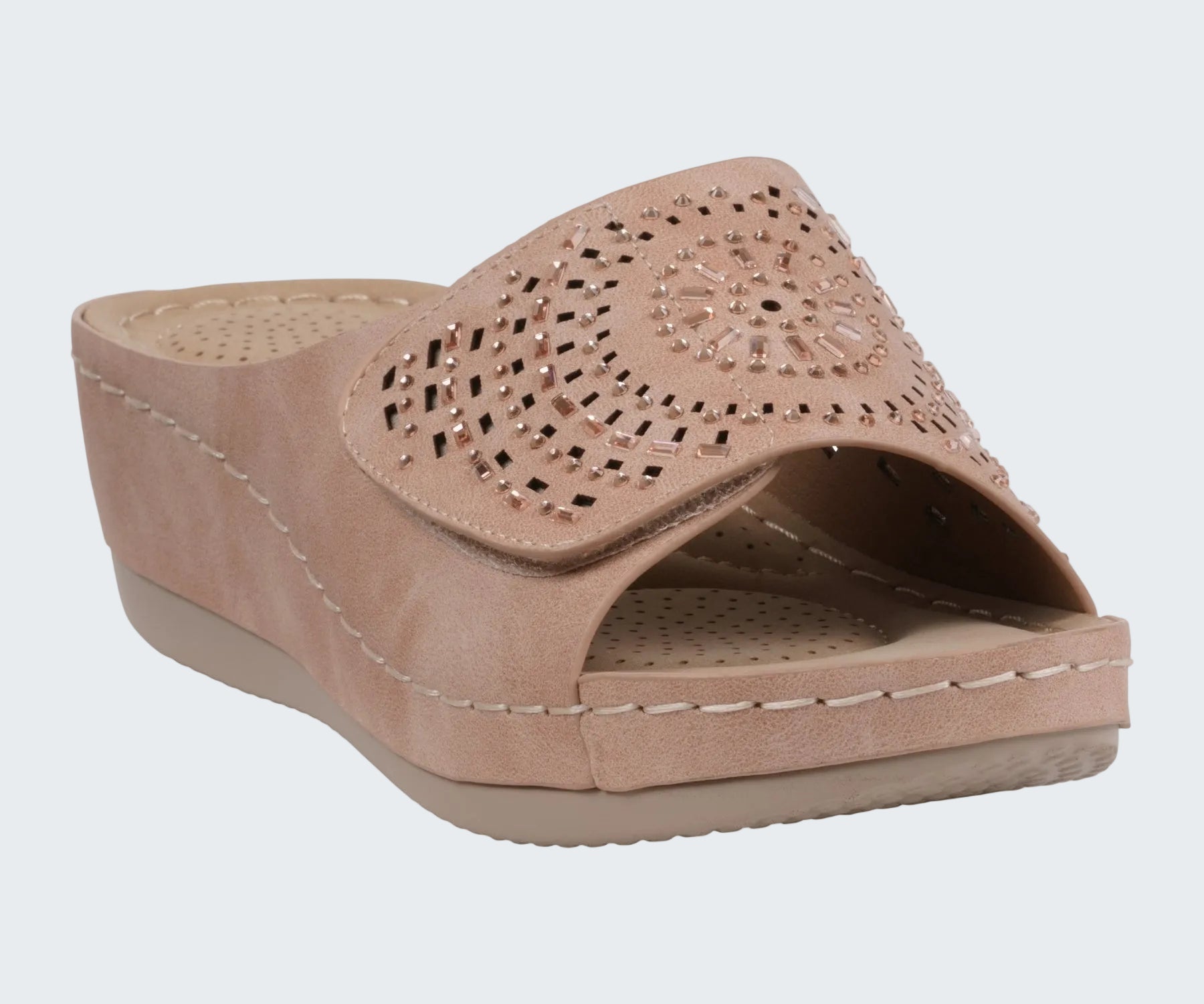 Beige sandal with cut-out design on a white background