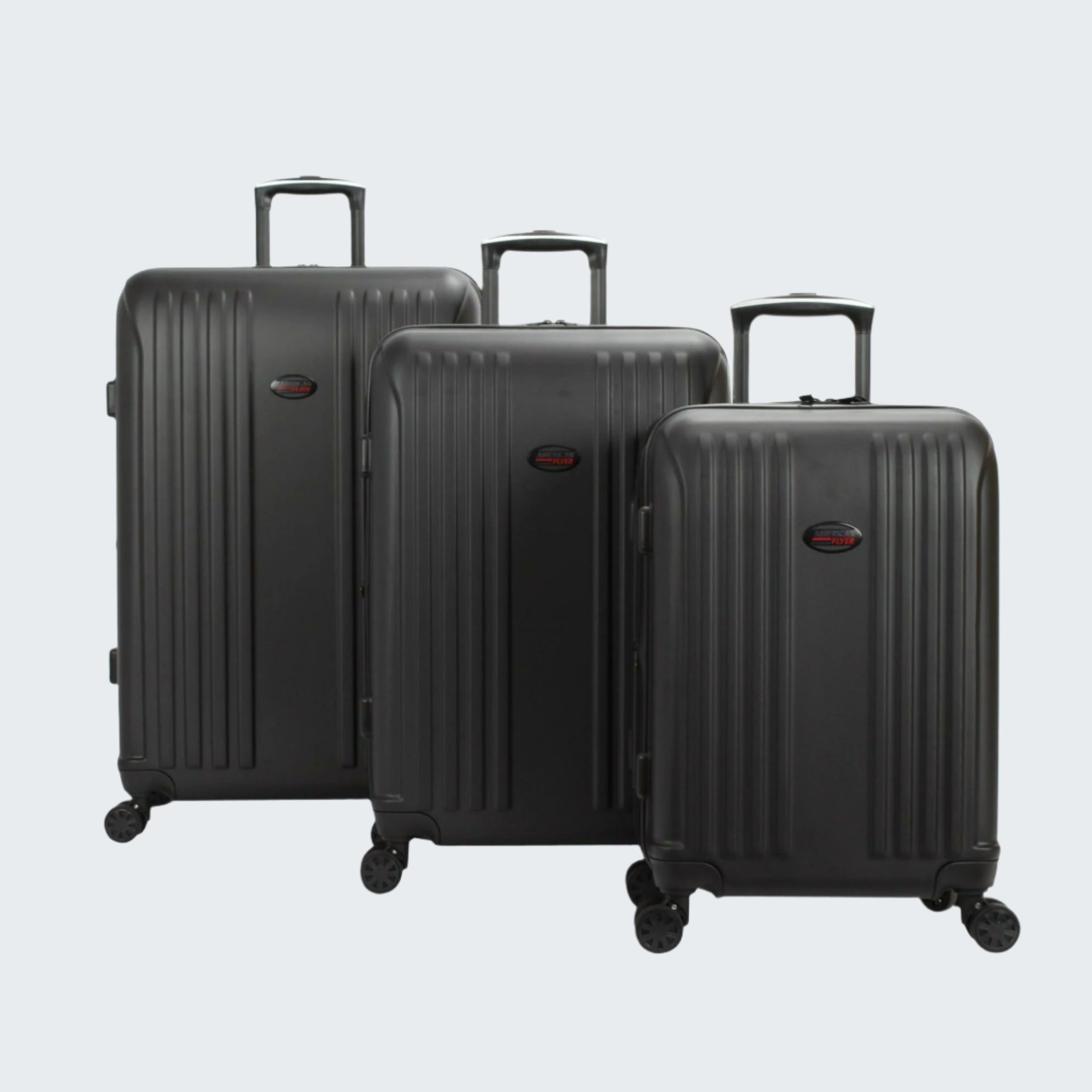 Three black suitcases of different sizes on a white background