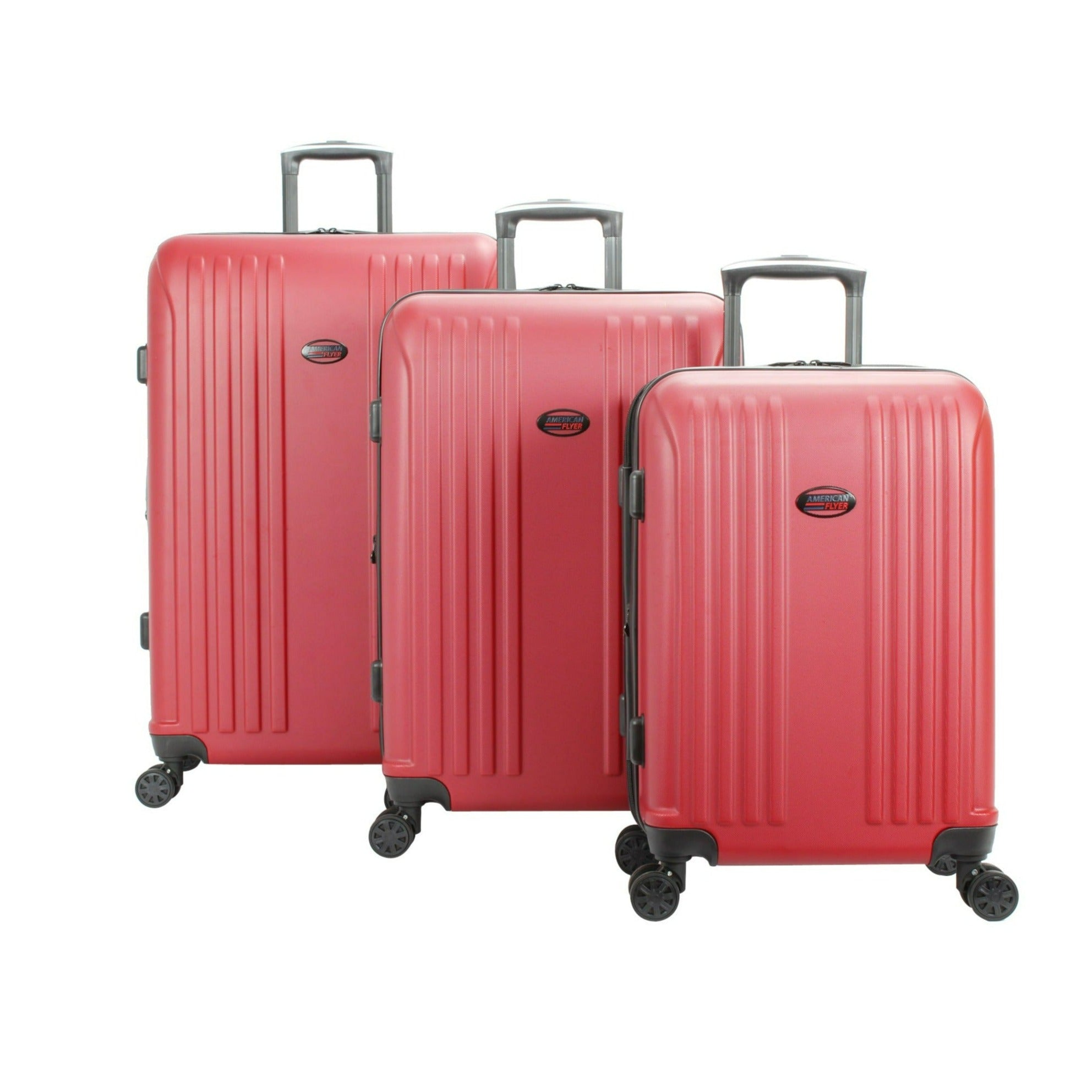 Three red suitcases of different sizes on a white background