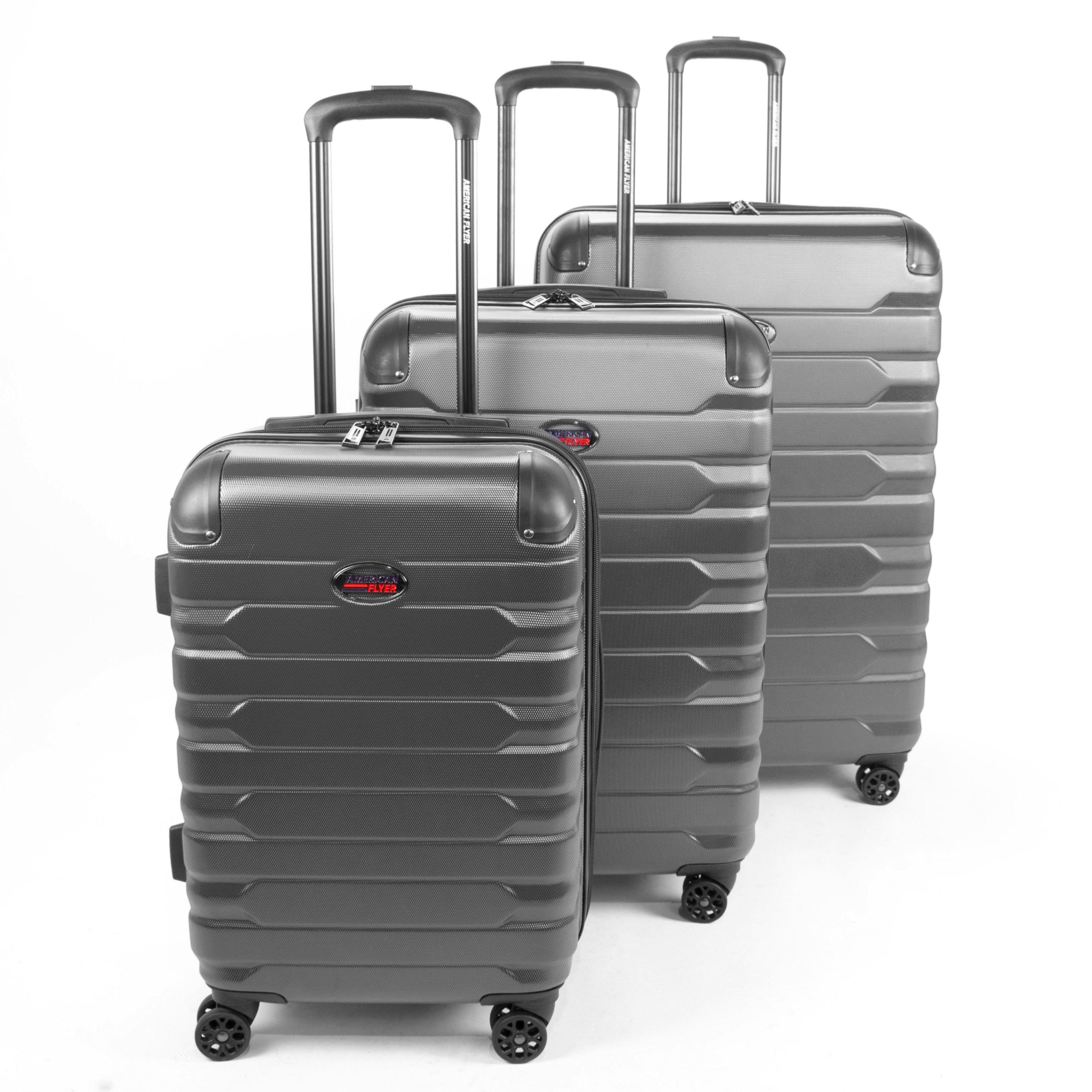 Set of three gray suitcases with a visible brand logo on a white background