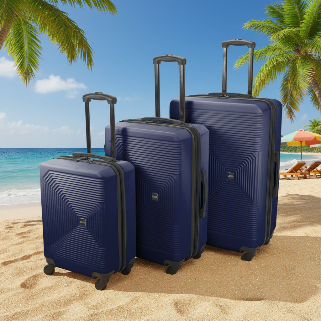 Set of three blue suitcases with geometric patterns on a white background