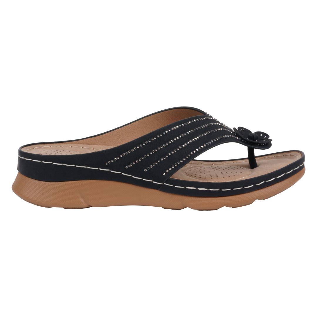 Black sandal with brown sole on a white background