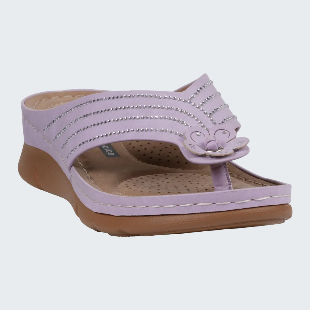 Lavender sandal with decorative straps on a white background
