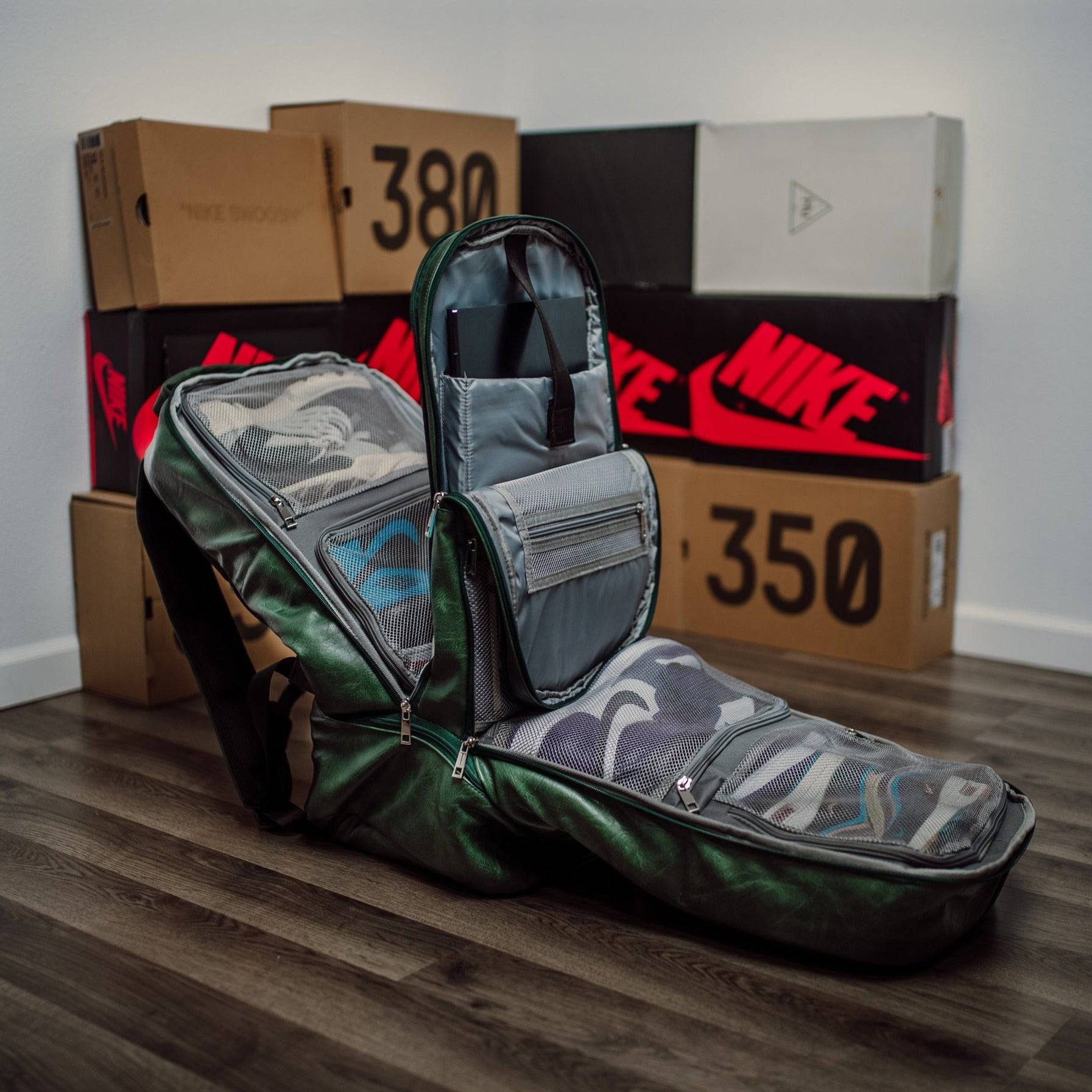 Green guitar case on a wooden floor with Nike boxes in the background