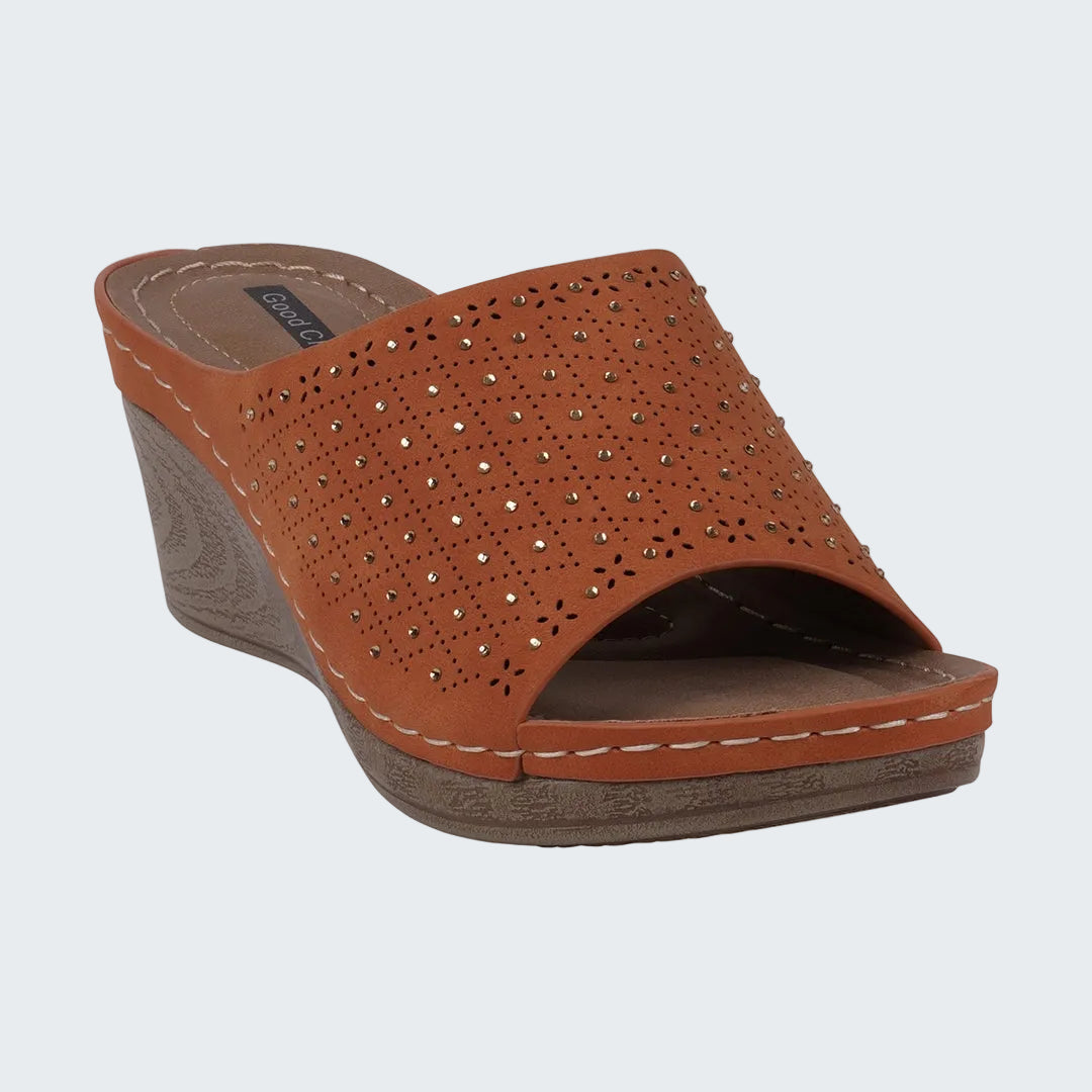 Brown wedge sandal with rhinestone embellishments on a white background