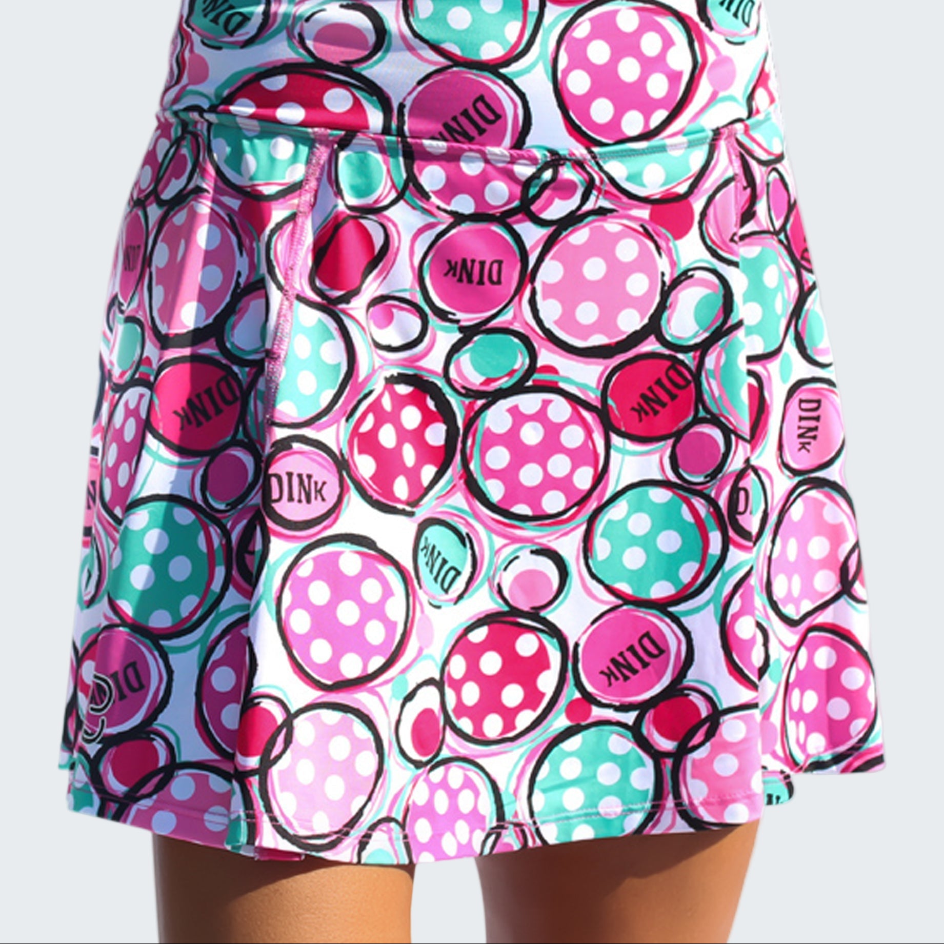 Colorful polka dot skirt with 'Dink' text on a white background