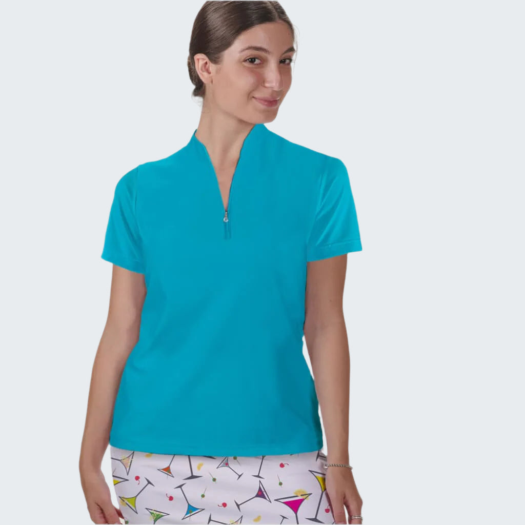 Woman wearing a turquoise polo shirt with a white background
