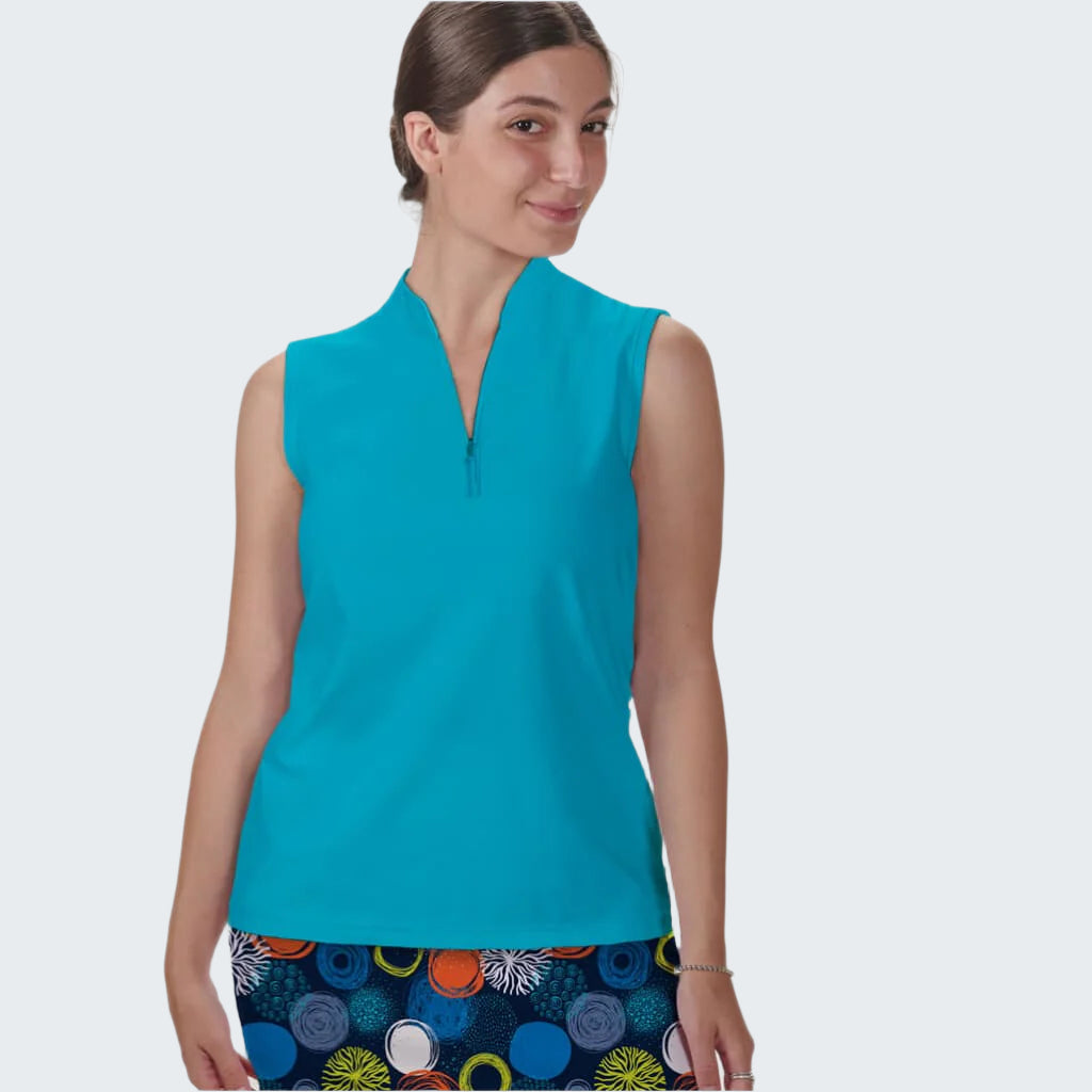 Woman wearing a turquoise sleeveless top with a colorful skirt on a white background