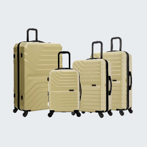 Set of beige suitcases with black handles and wheels on a white background
