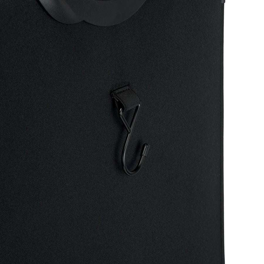 Black suitcase with a handle and a strap on a white background