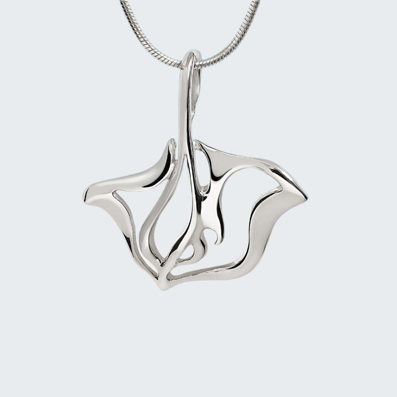 Silver pendant on a light gray background