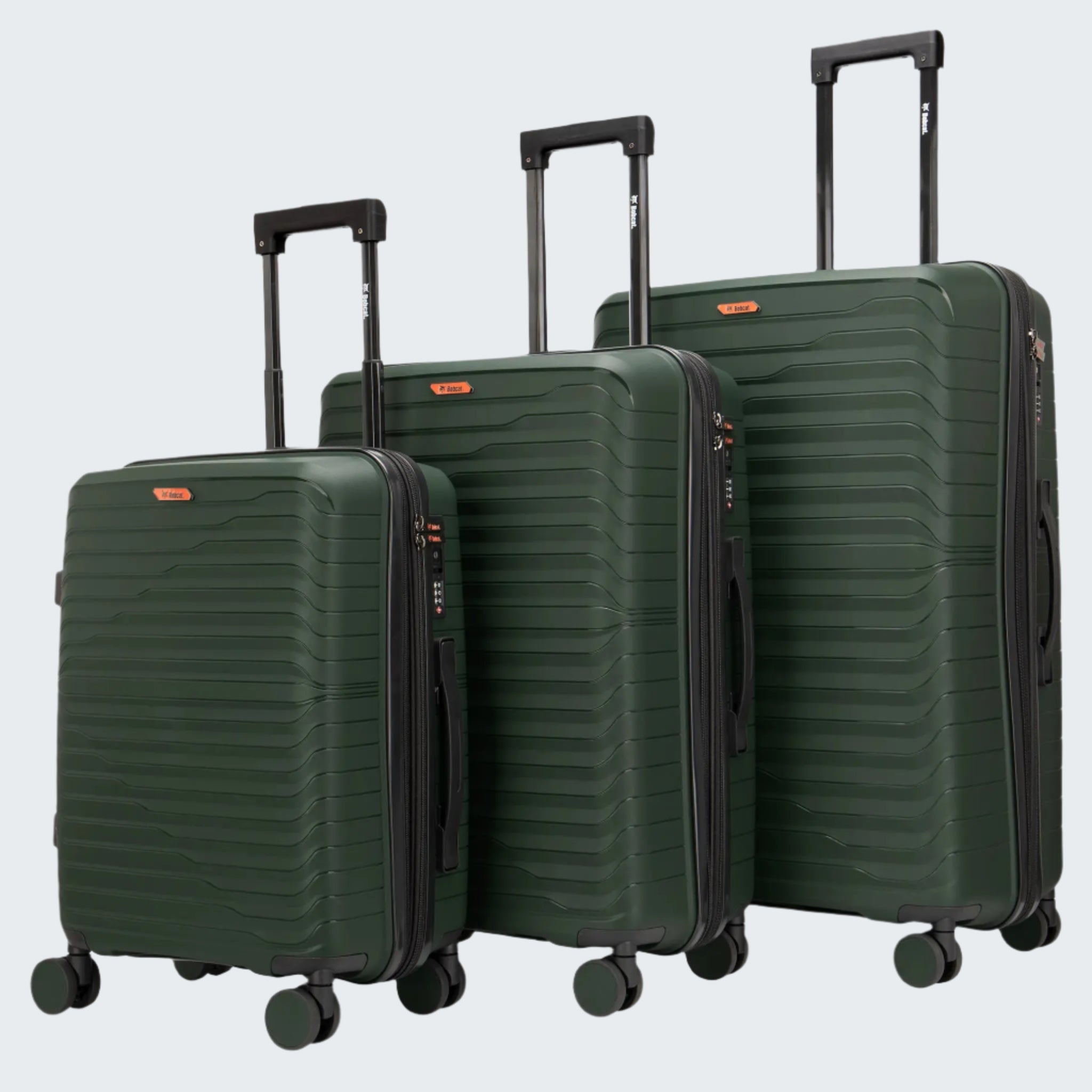 A set of three green Bobcat brand suitcases with a textured surface, including a carry-on, medium, and large sizes, equipped with 360° spinner wheels and trolley systems.