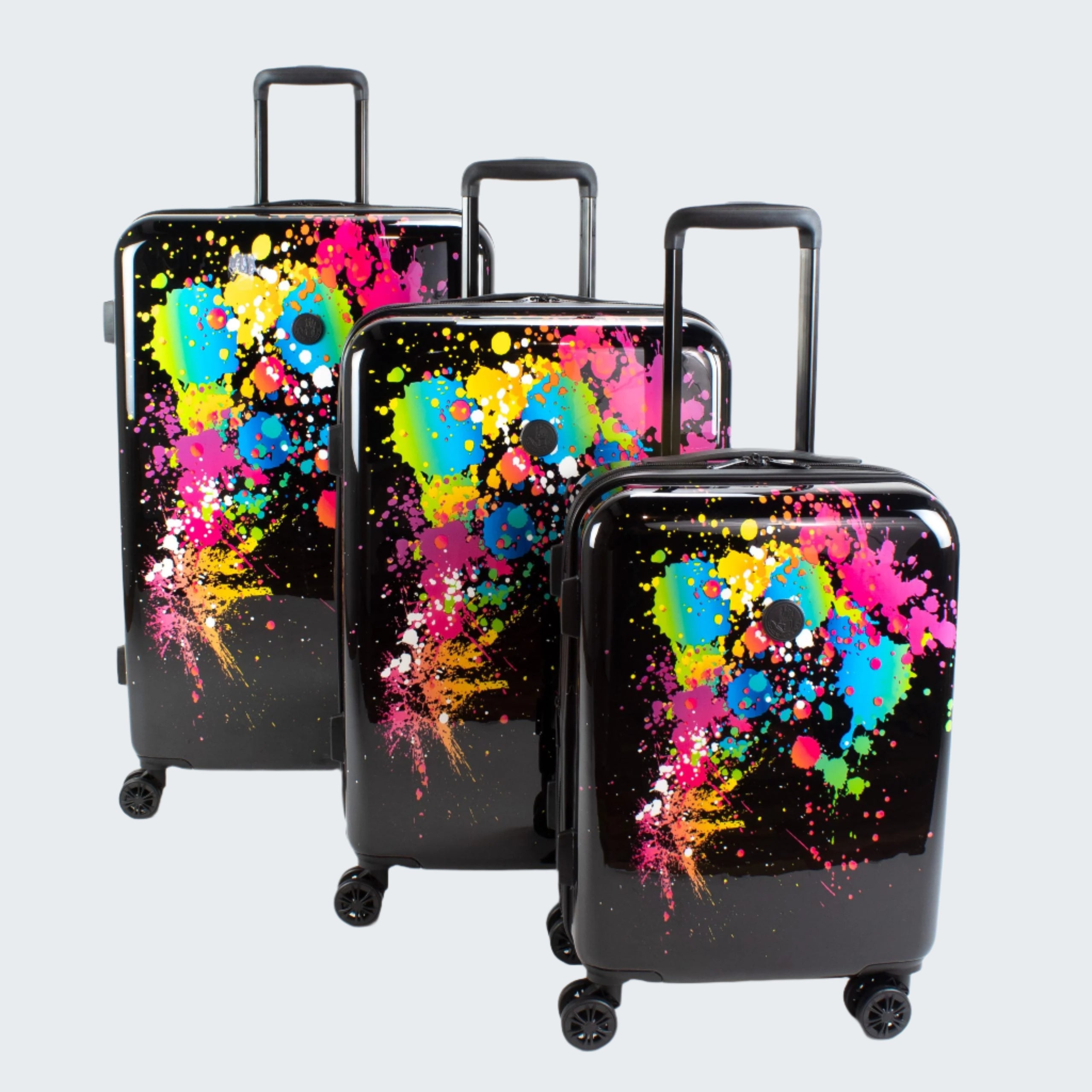 Three suitcases with colorful abstract designs on a white background