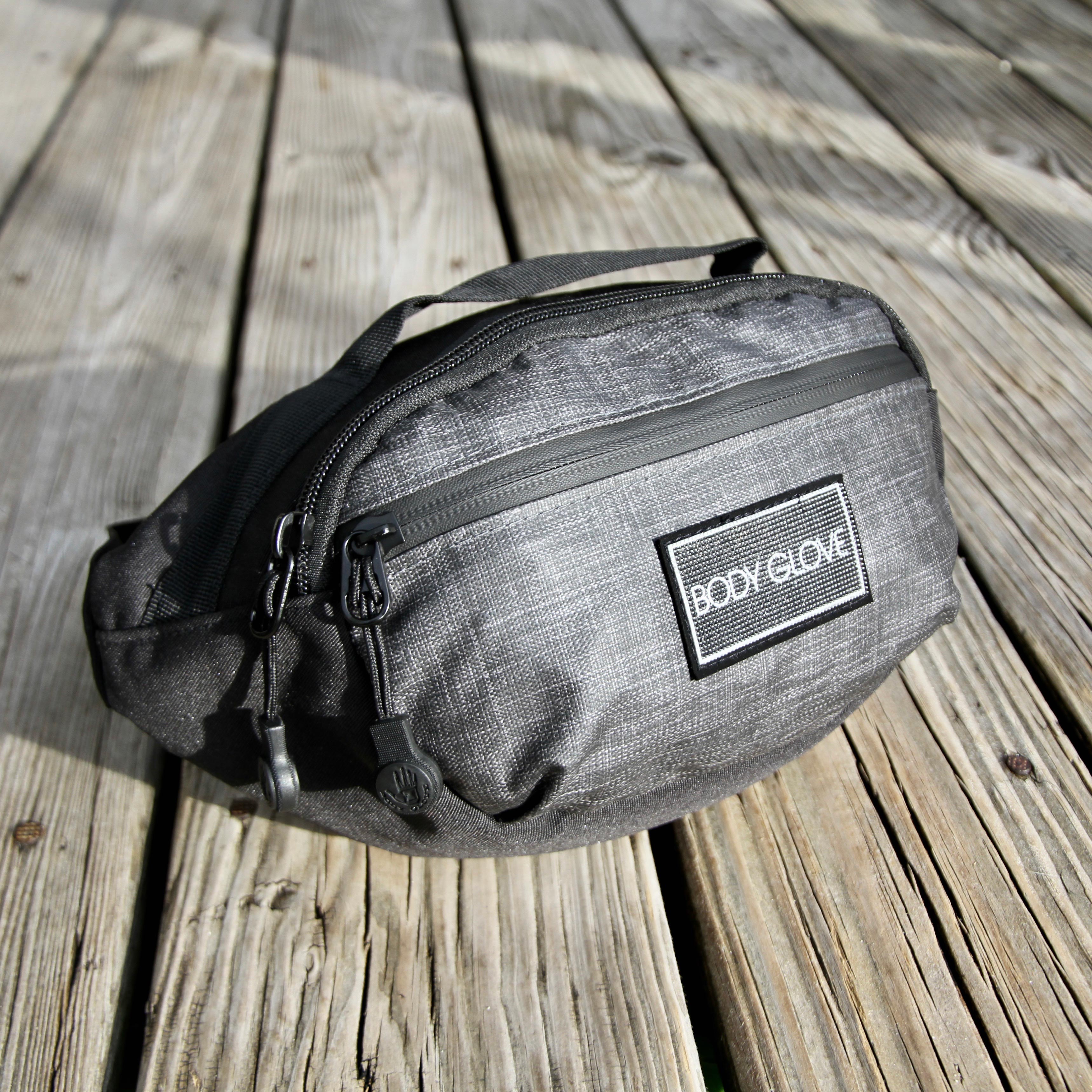 Gray waist bag with 'Body Glove' logo on a wooden surface