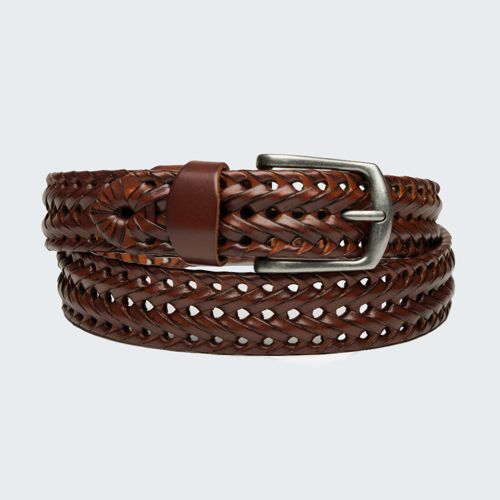 Brown woven leather belt with a silver buckle on a white background