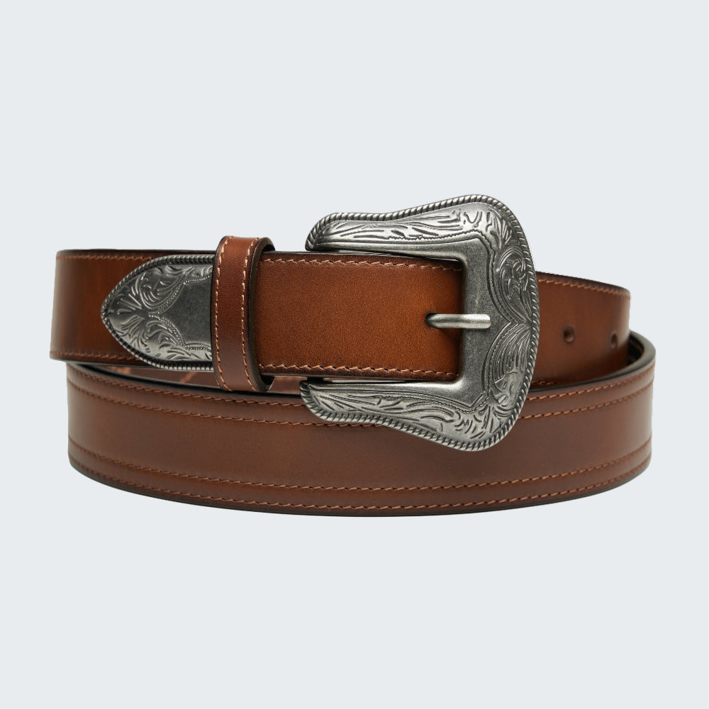 Brown leather belt with silver buckle on a white background