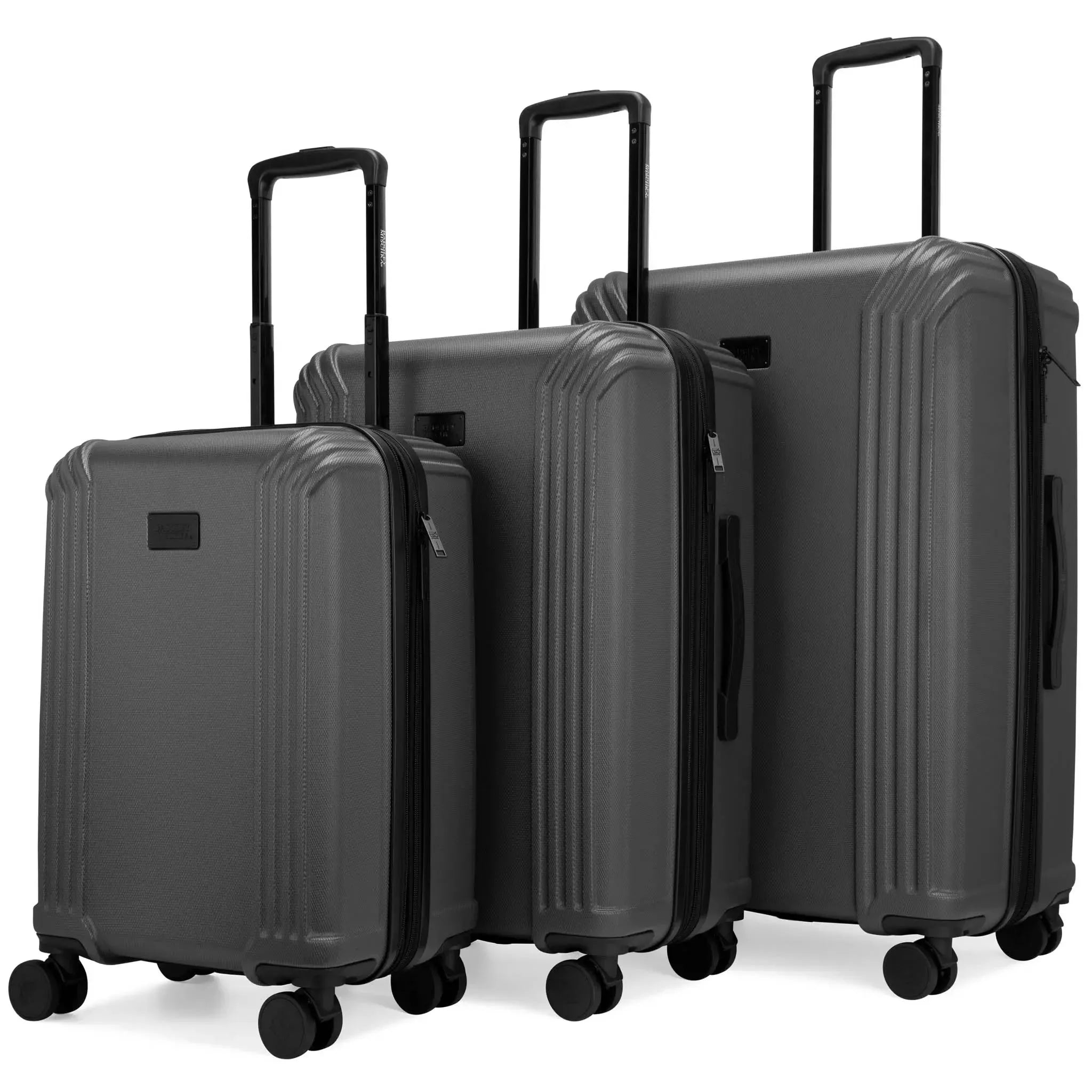 Set of three gray suitcases of different sizes on a white background
