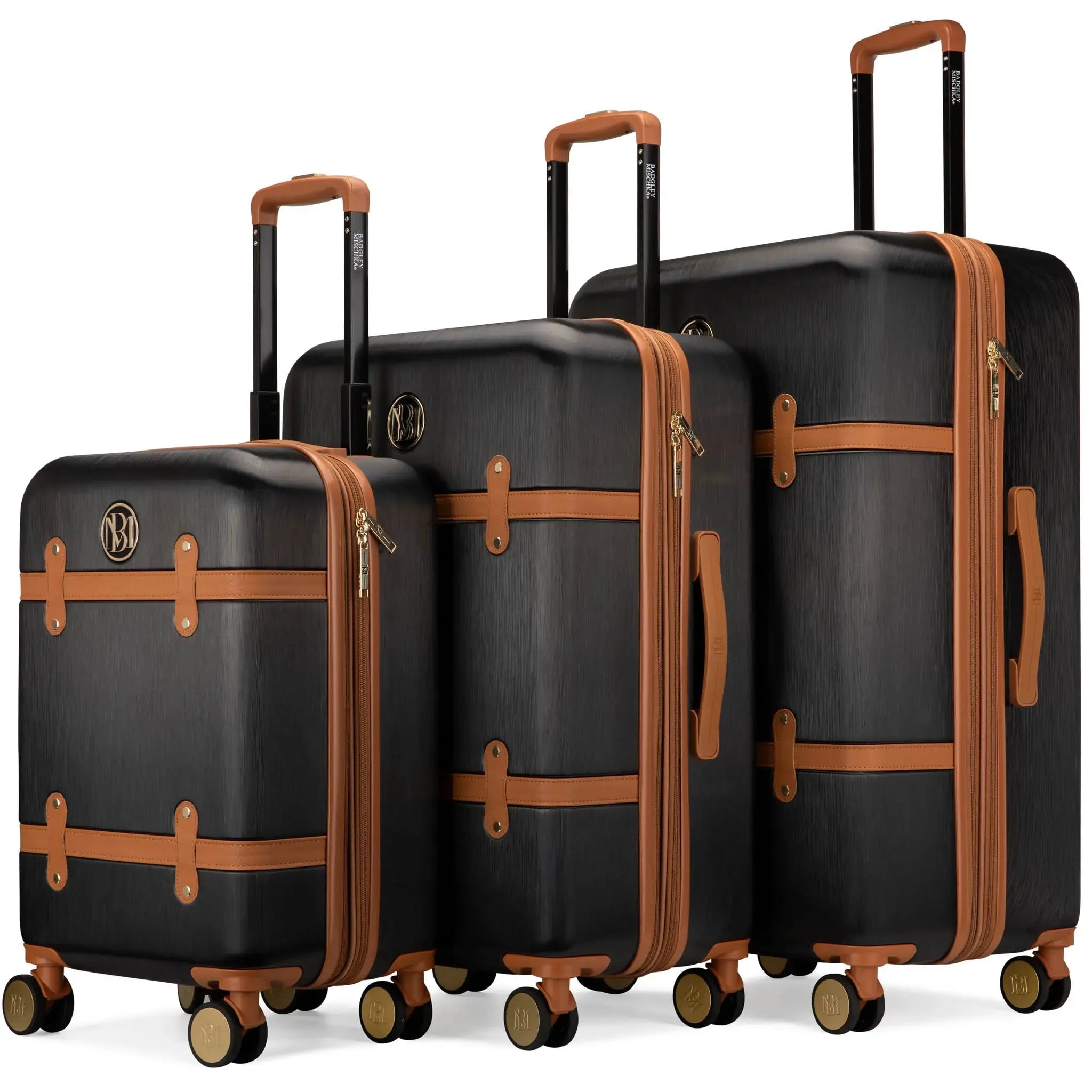 A set of three white retro-style expandable suitcases with vegan leather straps and metallic hardware, standing upright on four wheels.