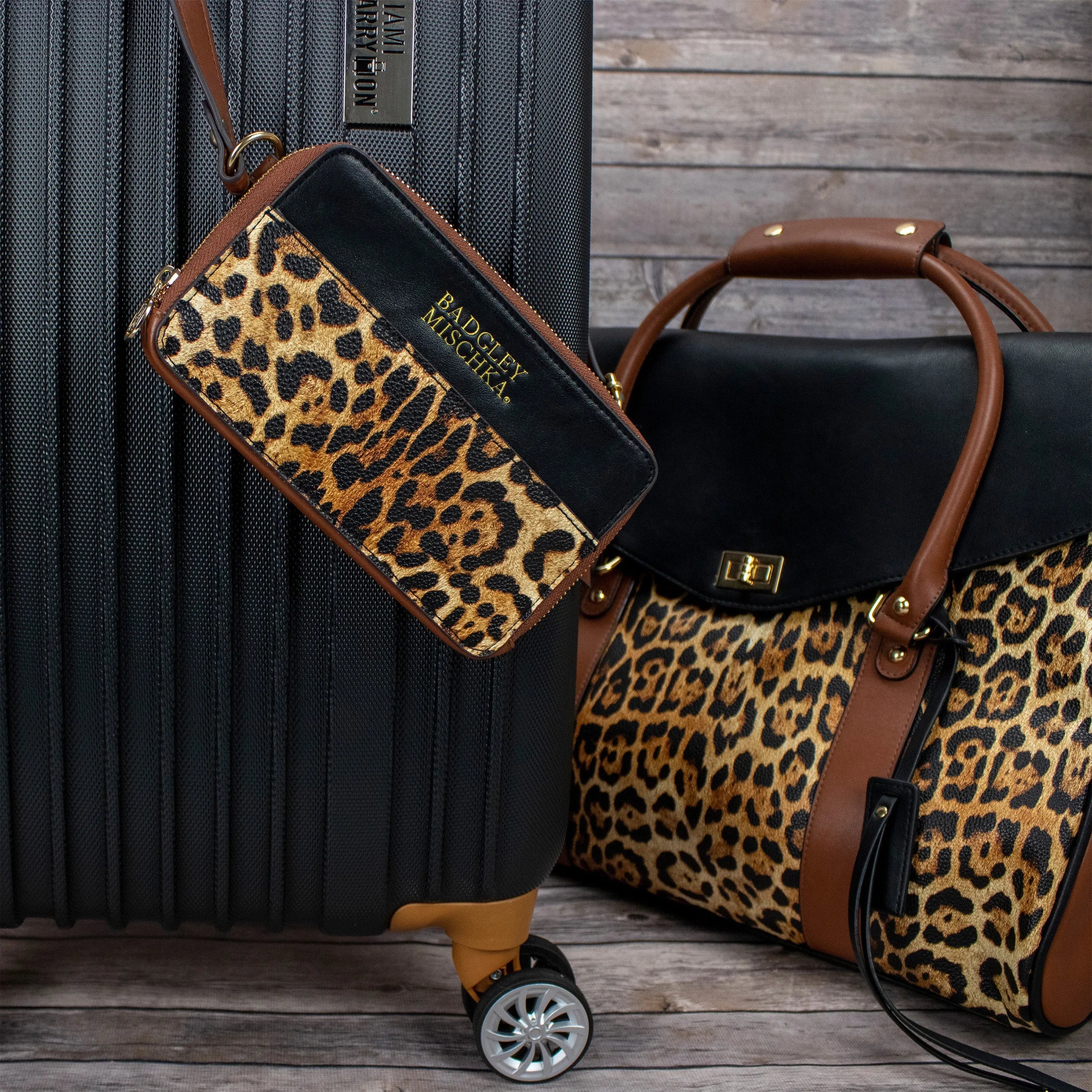 Leopard print handbag and suitcase on a wooden floor