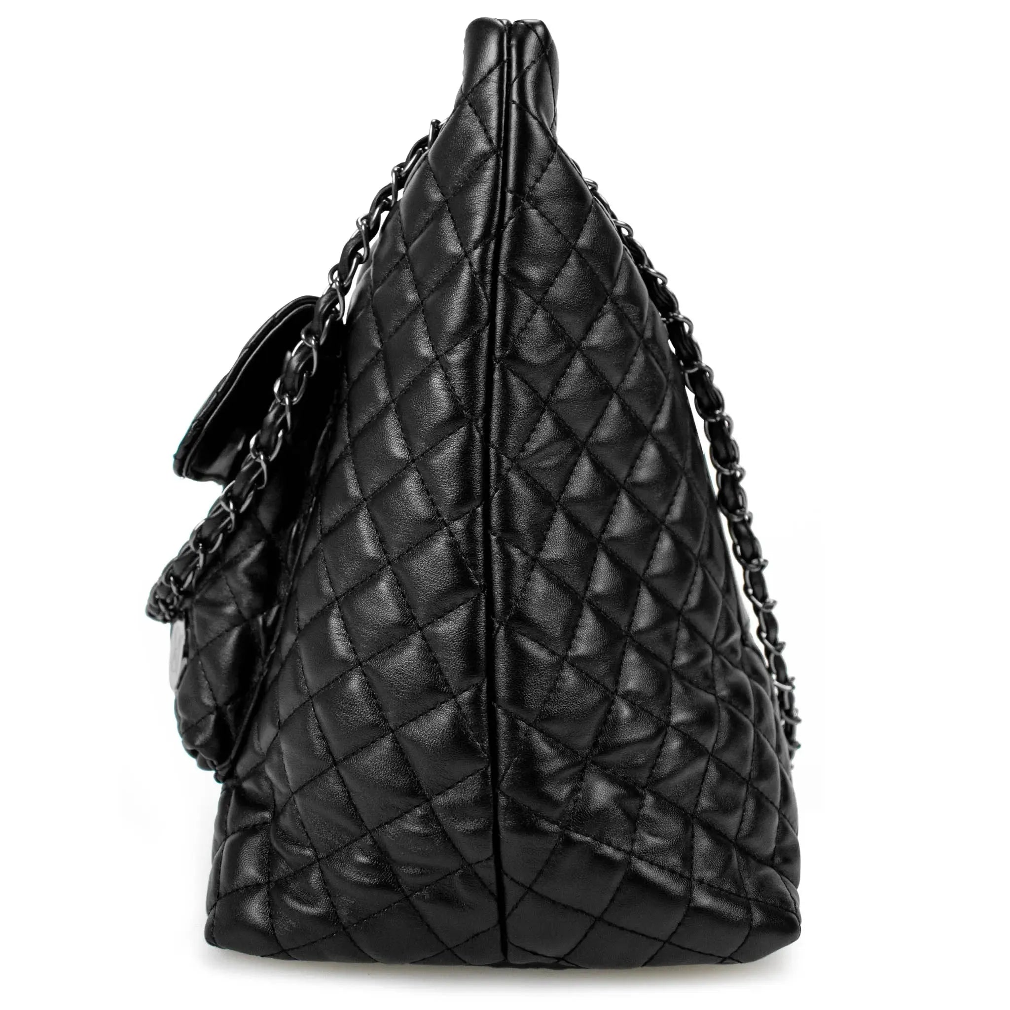 Black quilted handbag with chain detail on a white background