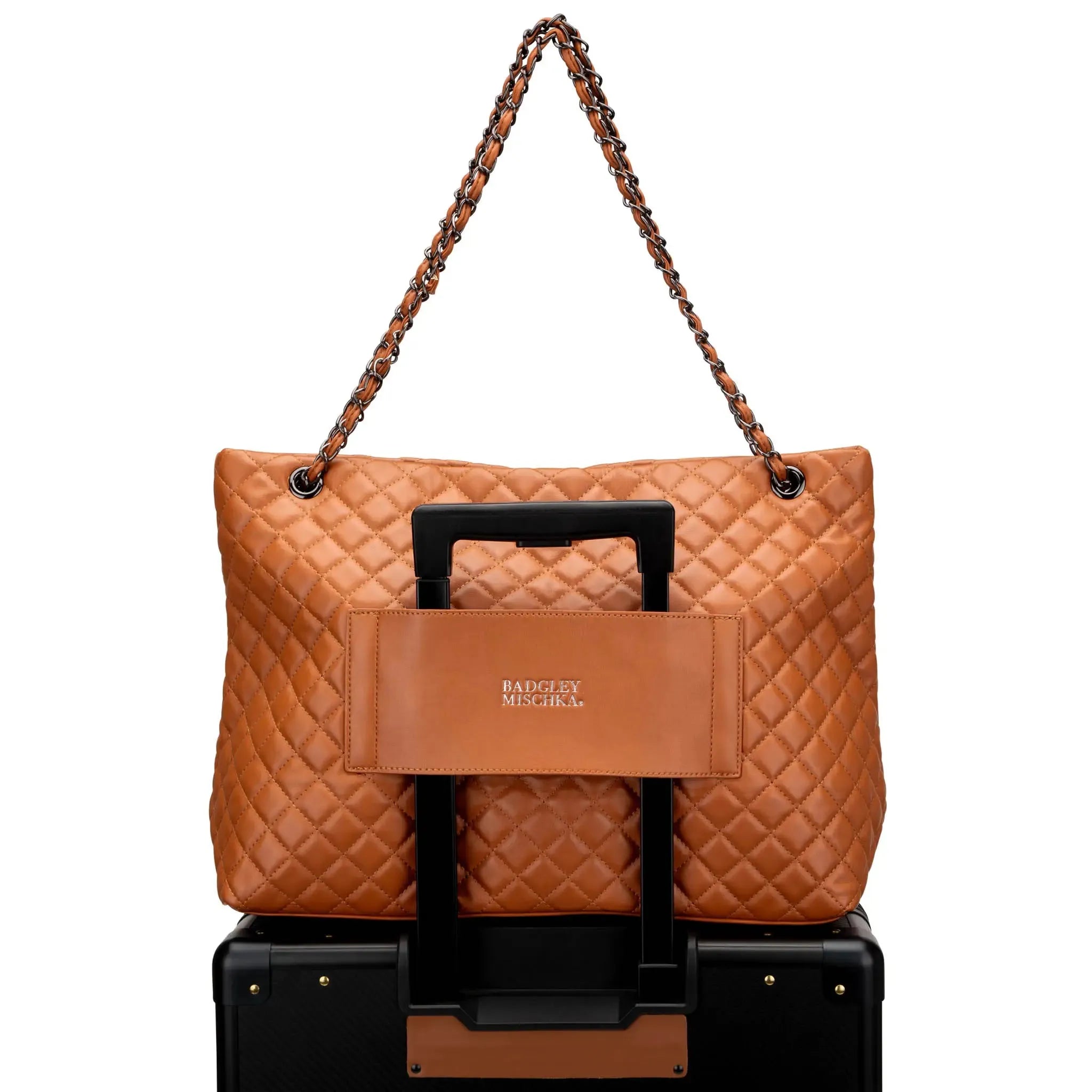 Brown quilted handbag with a black handle on a white background