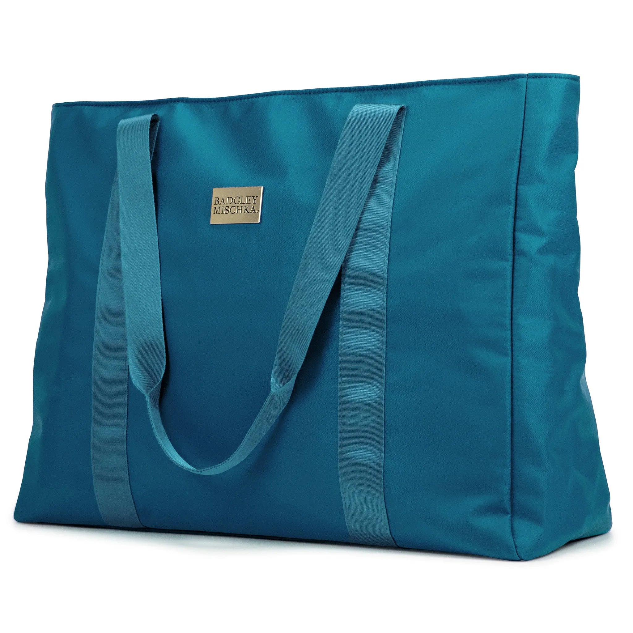 A black nylon tote bag with a shiny gold logo plate, soft webbing straps, and a zippered rear pocket. The bag is displayed in a way that showcases its spacious design and sleek finish.