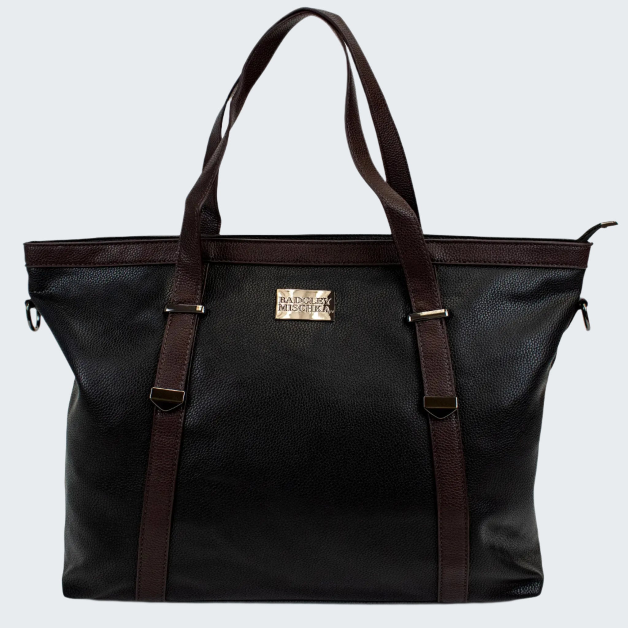 A black vegan leather weekender duffel bag with brown straps and gold logo plate, featuring a pebbled texture and zip closure.
