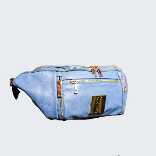 Blue bag with gold accents on a red reflective surface