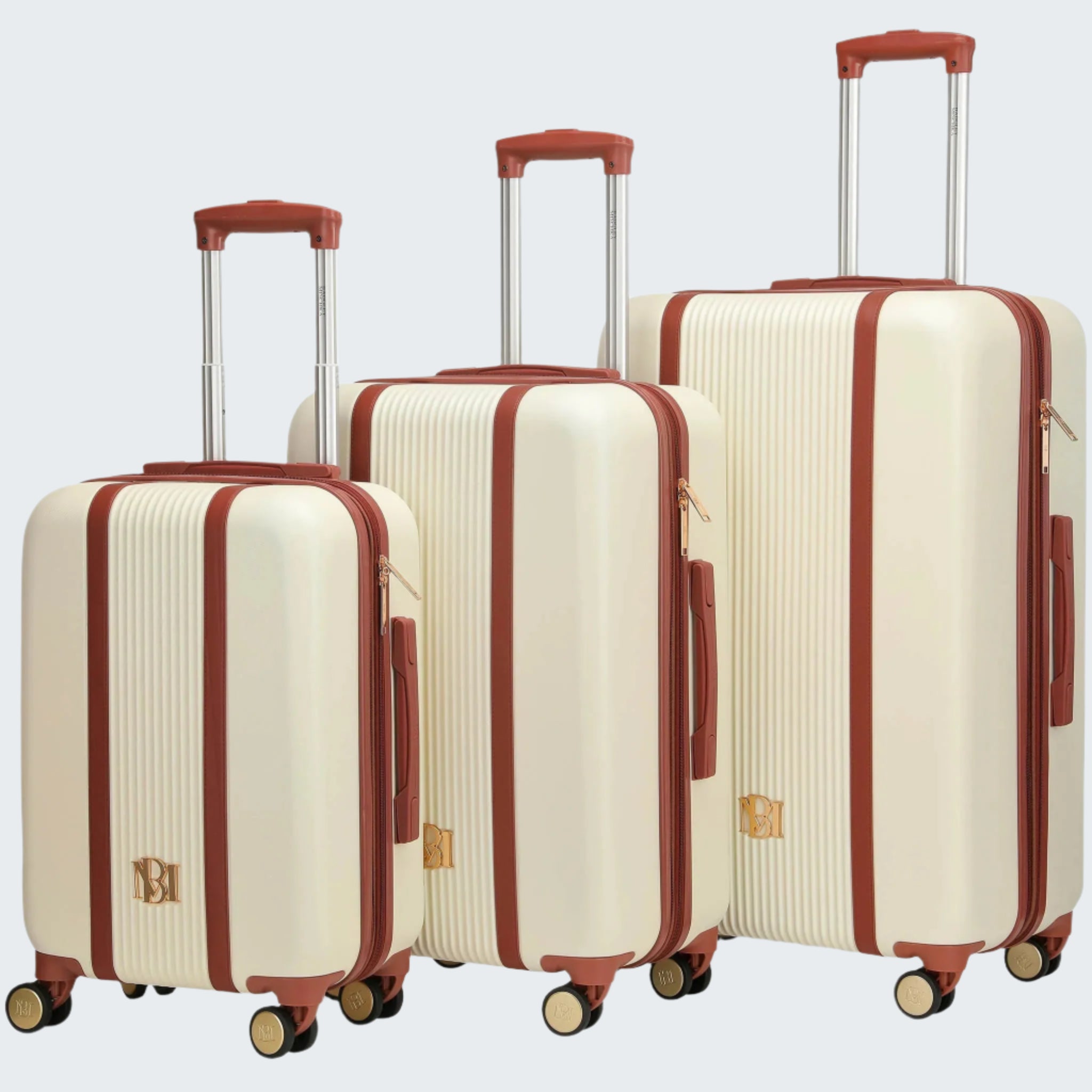 A set of three beige and gold Mia brand expandable spinner suitcases, with vegan leather details and gold accents, displayed in a nested arrangement with the largest to the left and the smallest to the right.