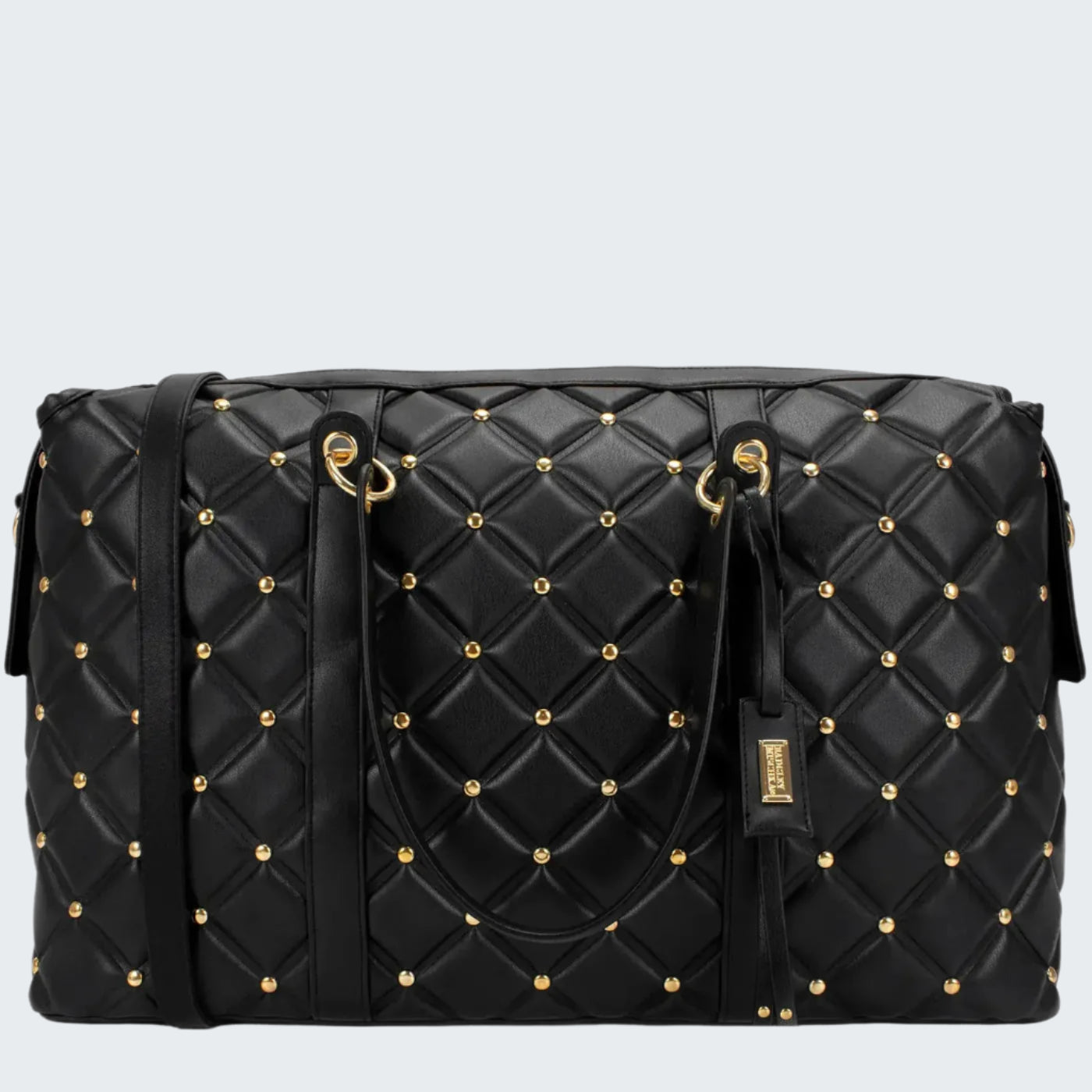 Black quilted handbag with gold studs on a white background