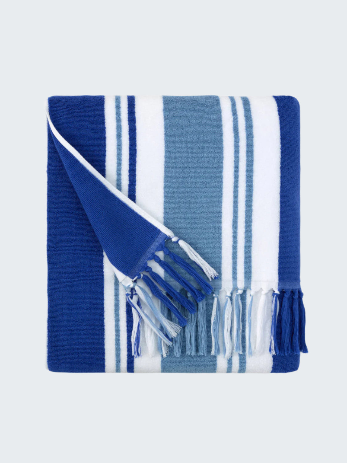 Blue and white striped towel with tassels on a white background